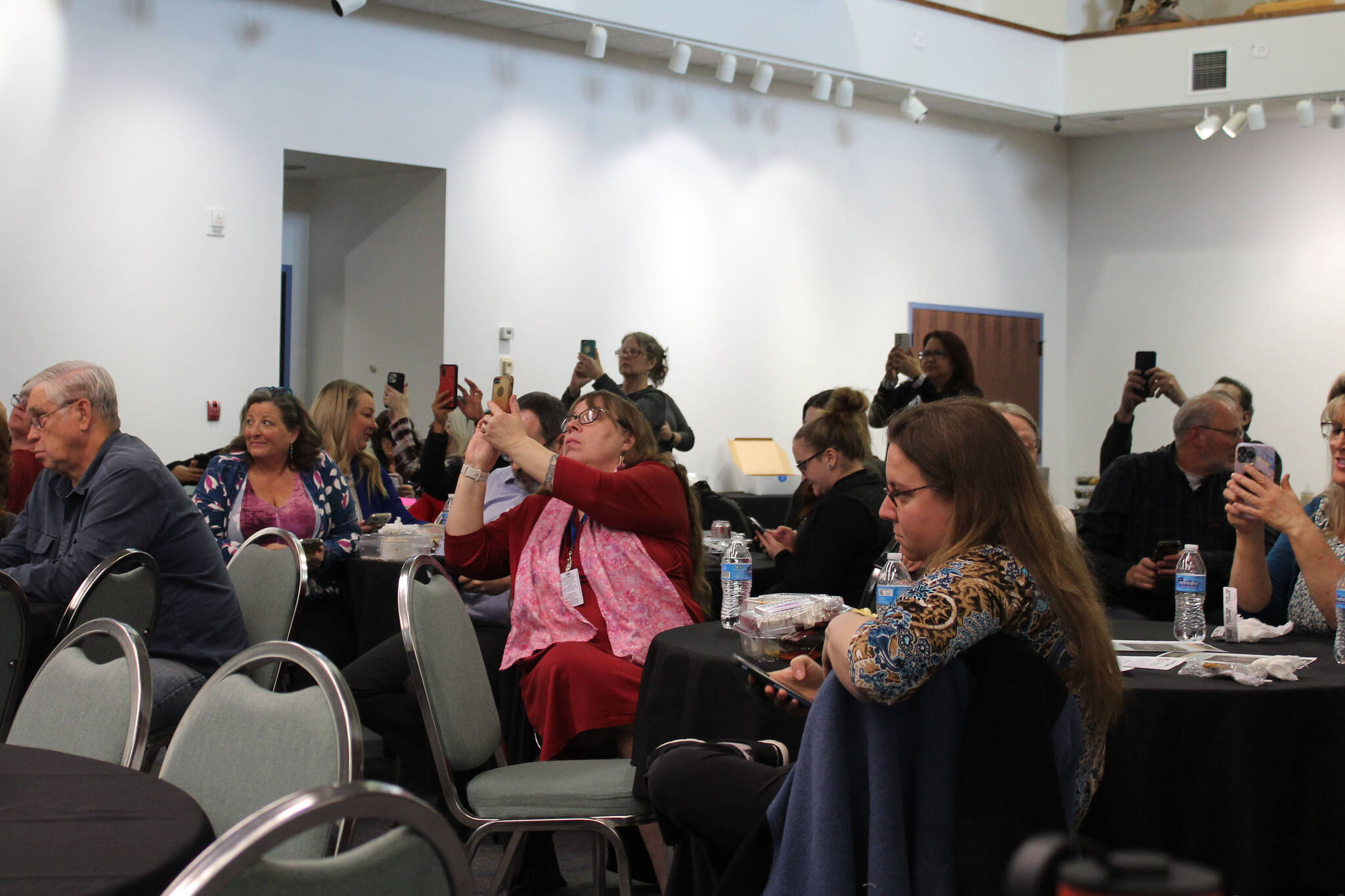 Luncheon attendees participate in a mock ranked choice voting election at the Kenai Chamber of Commerce and Visitor Center on Wednesday, April 13, 2022, in Kenai, Alaska. (Ashlyn O’Hara/Peninsula Clarion)