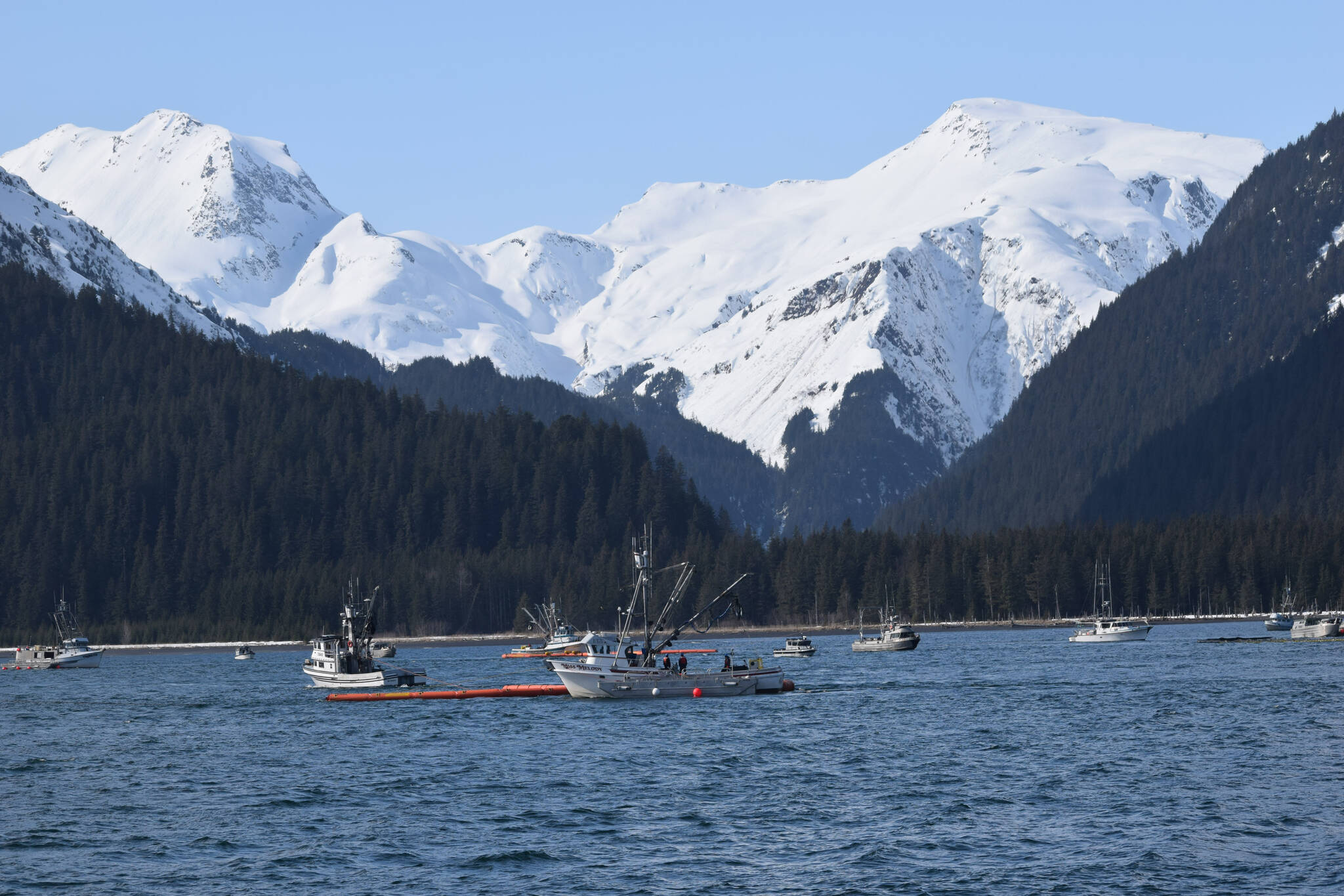 A fishing vessel fleet off the coast of Seward, Alaska, participates in oil spill response training hosted by the Prince William Sound Regional Citizens’ Advisory Council (RCAC), along with members of the Alyeska Pipeline Service Company, on Thursday, April 14, 2022. (Camille Botello/Peninsula Clarion)