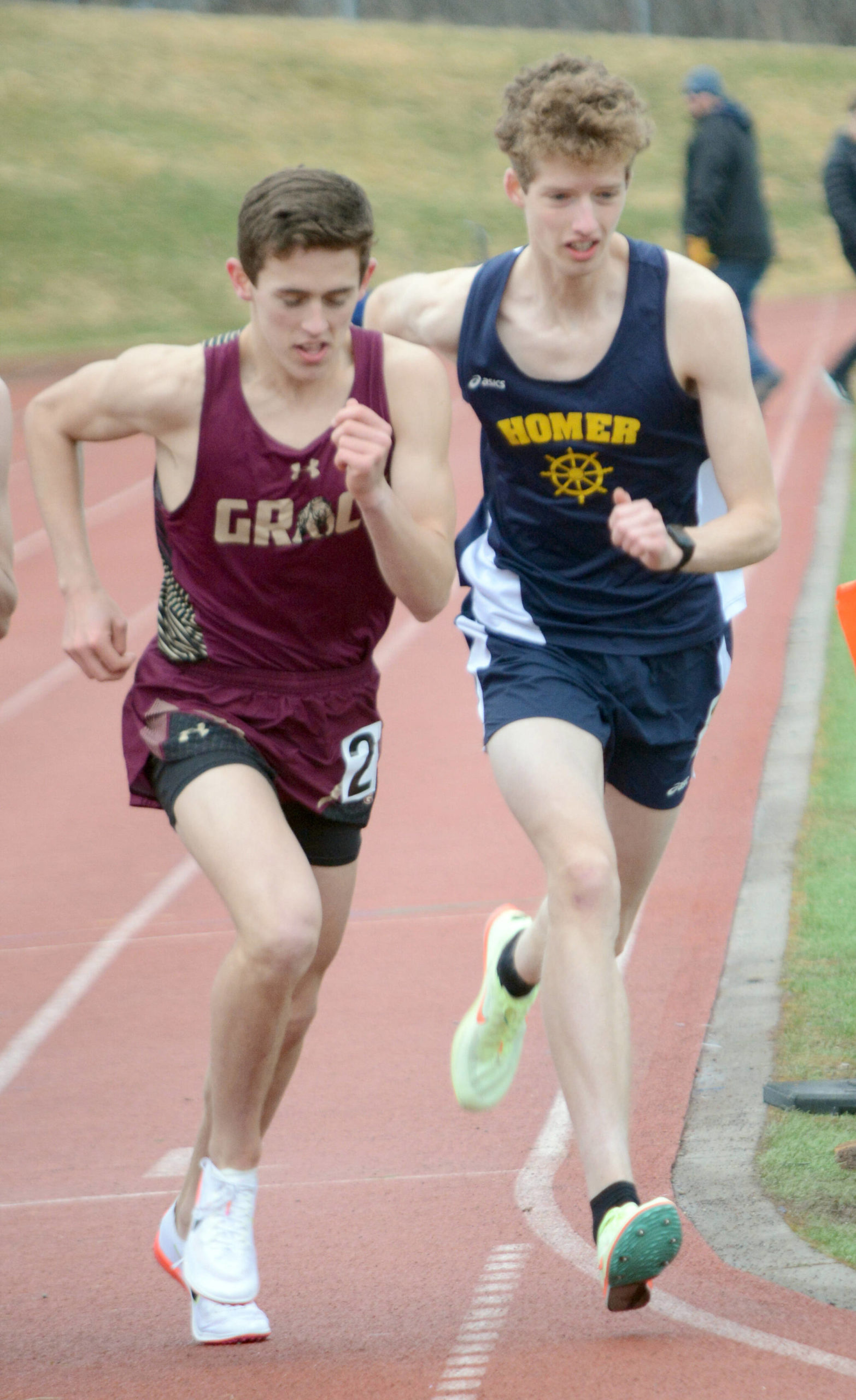 Homer’s Seamus McDonough, right, starts the 600-meter event on Saturday, April 23, 2022, for the Homer Invite at Homer High School in Homer, Alaska. (Photo by Michael Armstrong/Homer News)