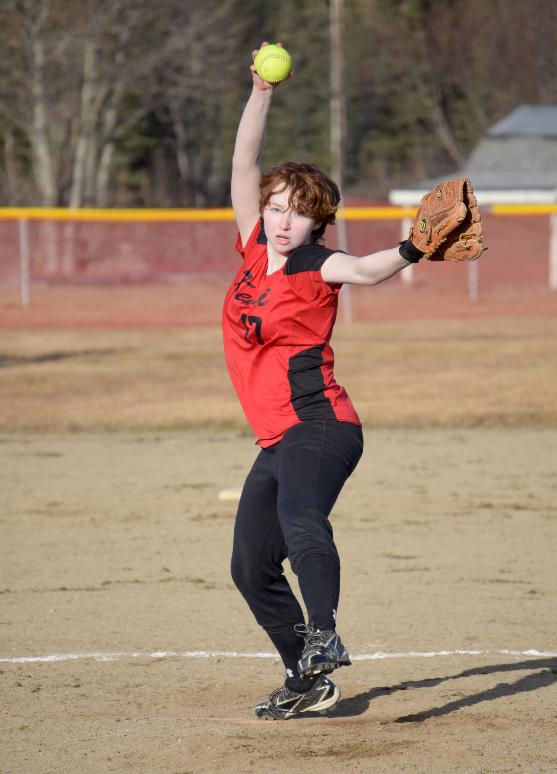 Kenai Central's Caitlin Crabb pitches to Soldotna on Monday, April 25, 2022, in Kenai, Alaska. (Photo by Jeff Helminiak/Peninsula Clarion)