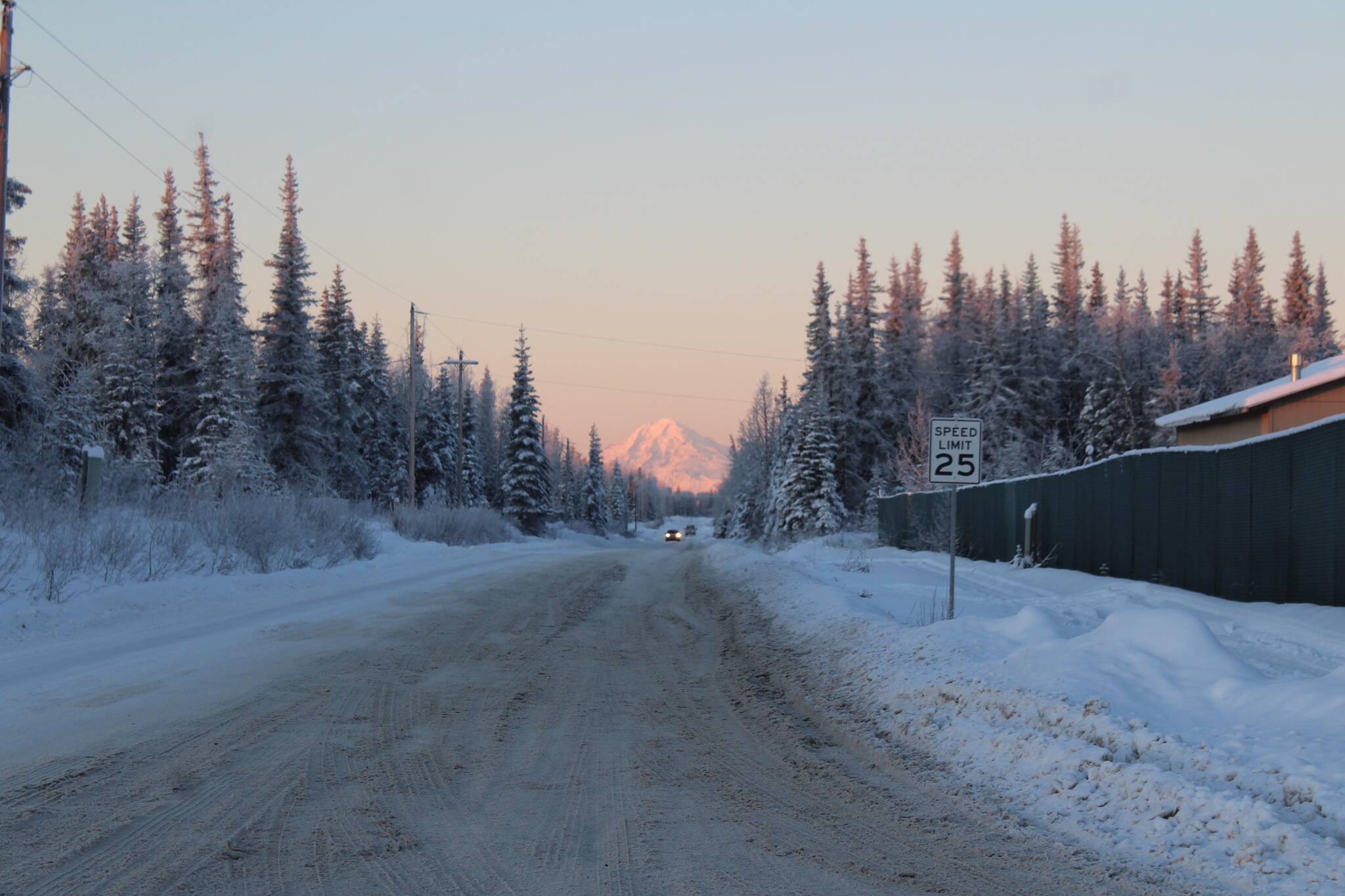 The sun sets on a backroad near Kalifornsky Beach Road on Dec. 21, 2021. New regulations allowing all-purpose vehicles on some roads go into effect Jan. 1, 2022. (Photo by Ashlyn O’Hara/Peninsula Clarion)