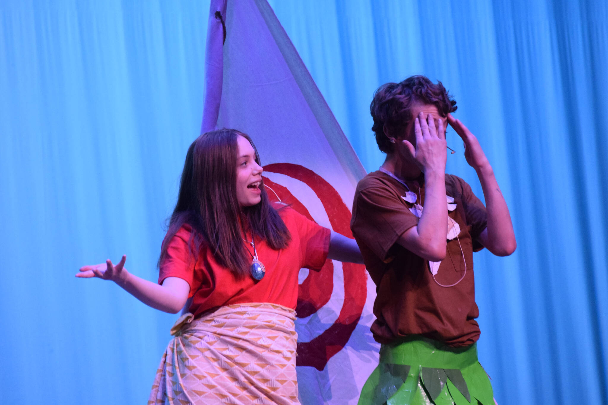 Mylee Yeoman, left, and Cooper Tallent-Darling perform “Moana” during a dress rehearsal at the Renee C. Henderson Auditorium in Kenai, Alaska, on Wednesday, April 27, 2022. (Camille Botello/Peninsula Clarion)