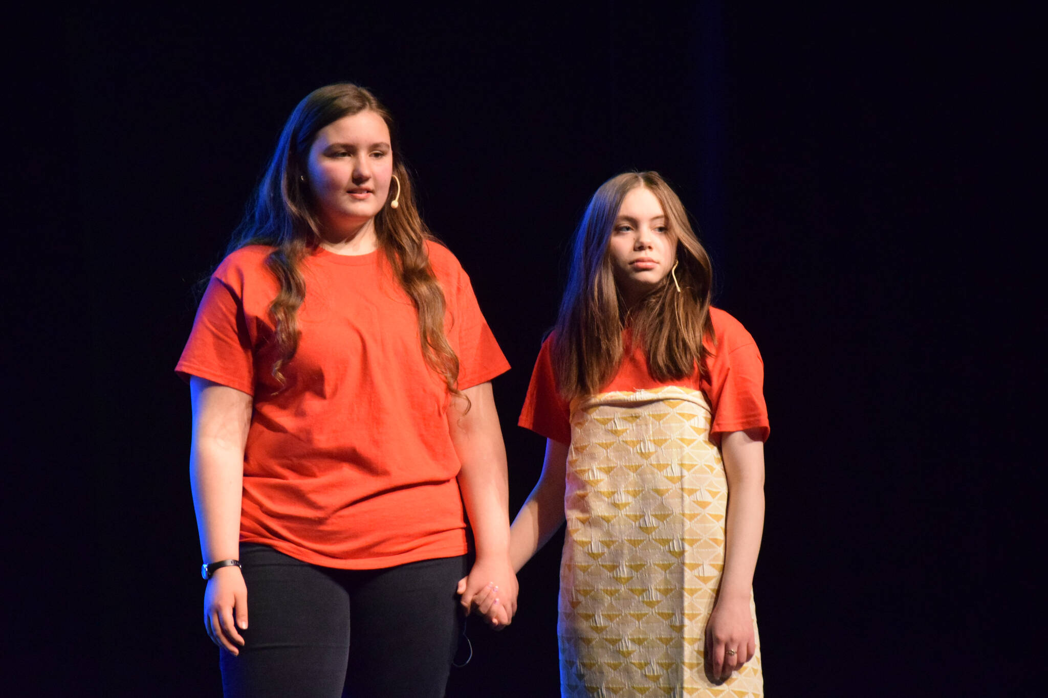 Emerie Mallard, left, and Mylee Yeoman perform “Moana” during a dress rehearsal at the Renee C. Henderson Auditorium in Kenai, Alaska, on Wednesday, April 27, 2022. (Camille Botello/Peninsula Clarion)