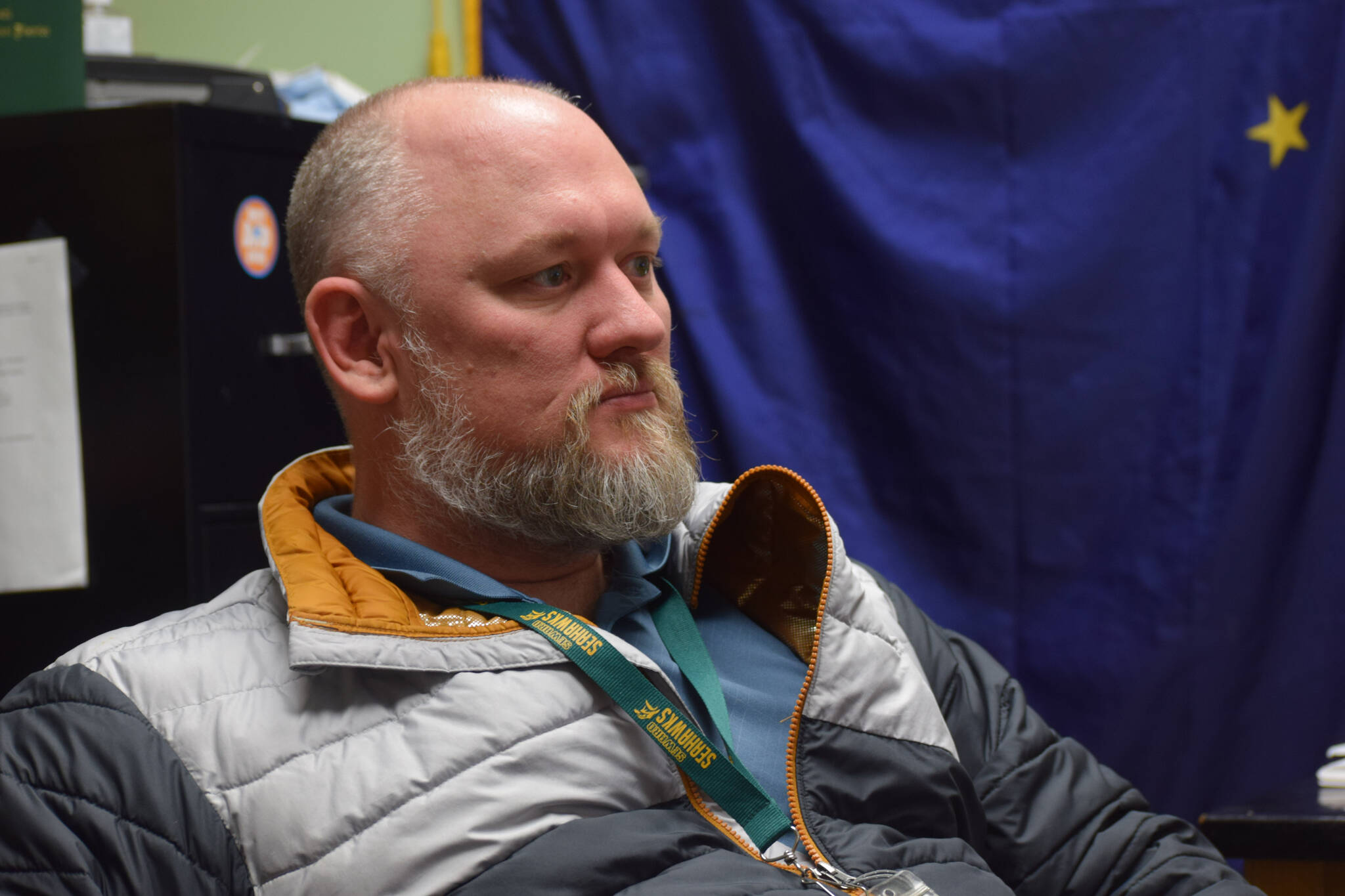 Henry Burns, principal of Seward High School, works in his office in in Seward, Alaska on Tuesday, May 3, 2022. (Camille Botello/Peninsula Clarion)
