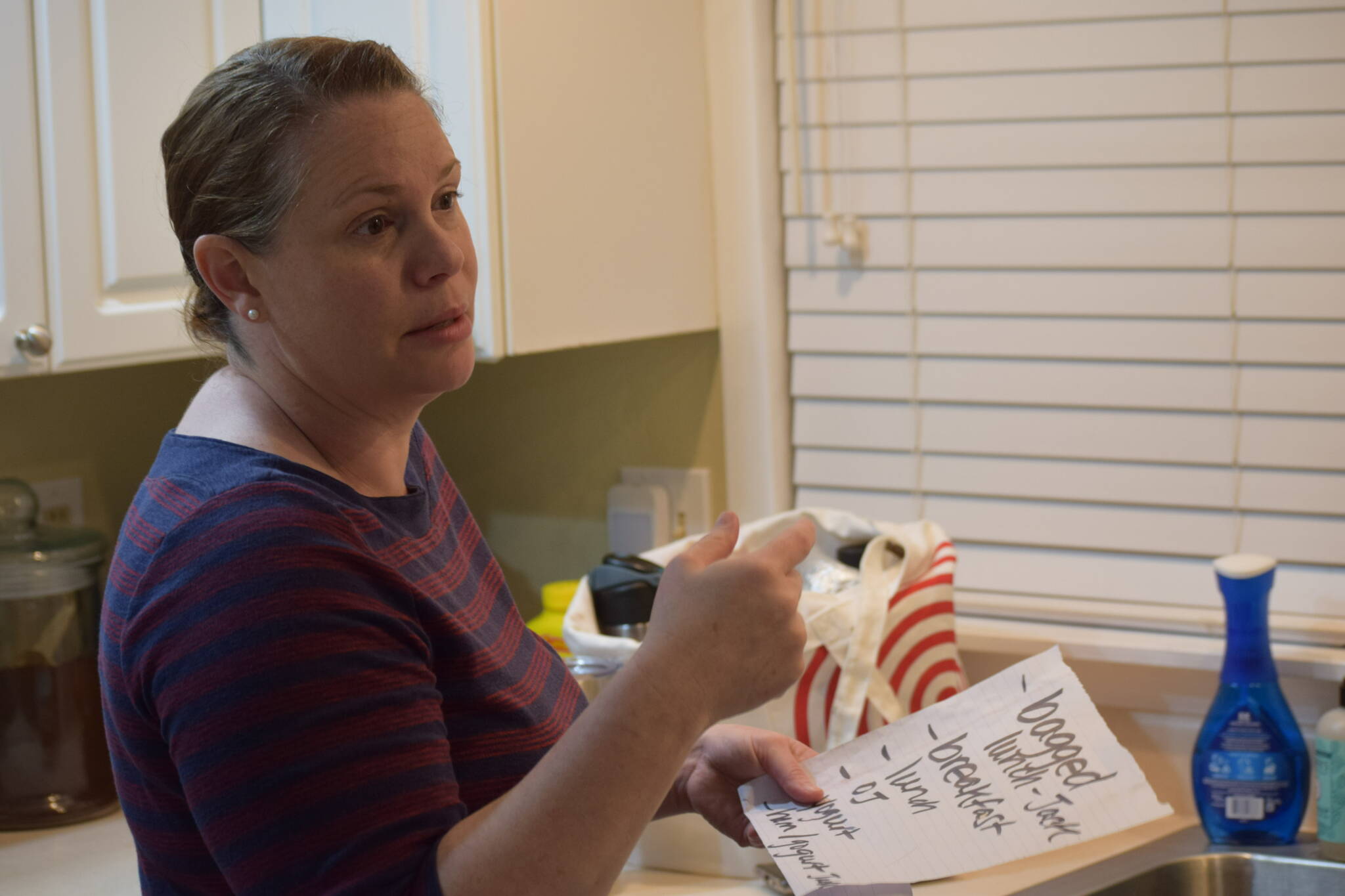 Christina Burns, librarian for the Kenai Peninsula Borough School District, packs food for the day at her home in Anchorage, Alaska, around 4 a.m. on Tuesday, May 3, 2022. (Camille Botello/Peninsula Clarion)