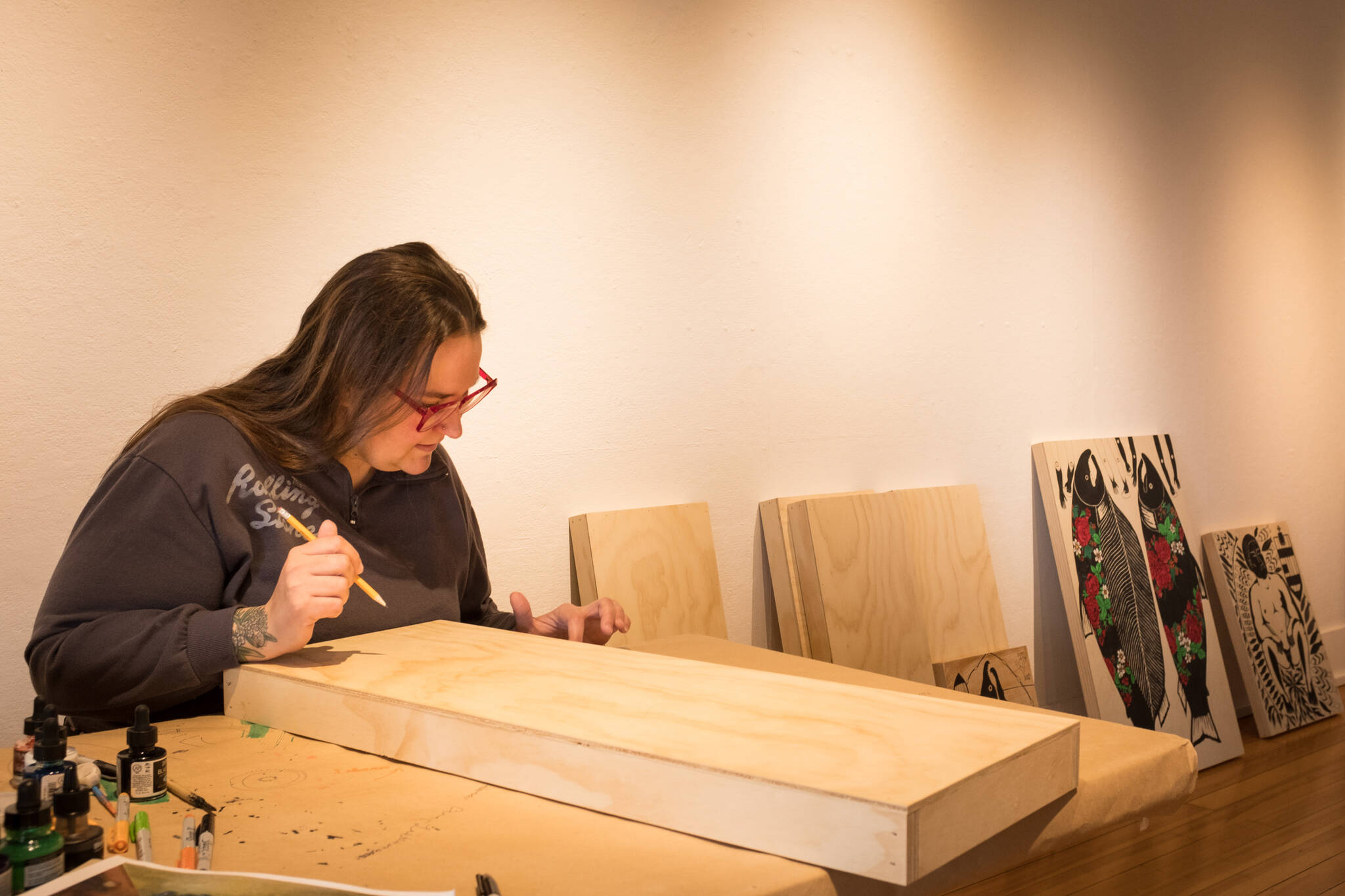 Photos by Sean McDermott 
Artist Amber Webb starts works on a new drawing at Bunnell Street Arts Center. Her work will be on display at the gallery through the month of May.