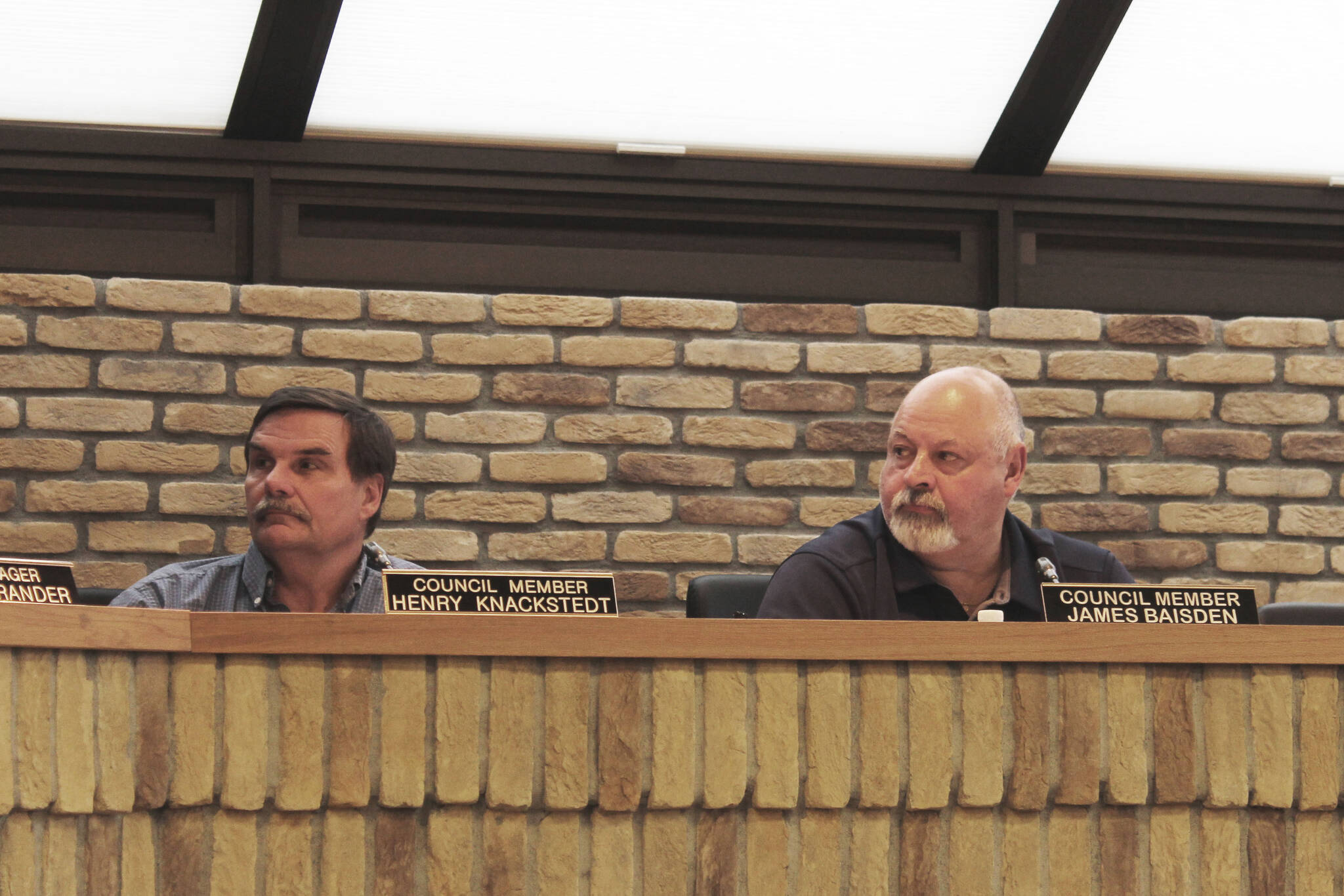 Kenai City Council members Henry Knackstedt, left, and James Baisden participate in a council meeting on Wednesday, May 4, 2022, in Kenai, Alaska. (Ashlyn O’Hara/Peninsula Clarion)