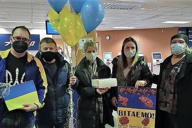 Dasha Pearson, second from right, with her sister Natalia Dontsova, center, and father Alexander Dontsov, second from right, in Seattle on March 8, 2022. Pearson’s family fled Ukraine when the war started, and now they and other displaced Ukrainians are trying to find a home in Alaska. (Courtesy photo / Dasha Pearson)
