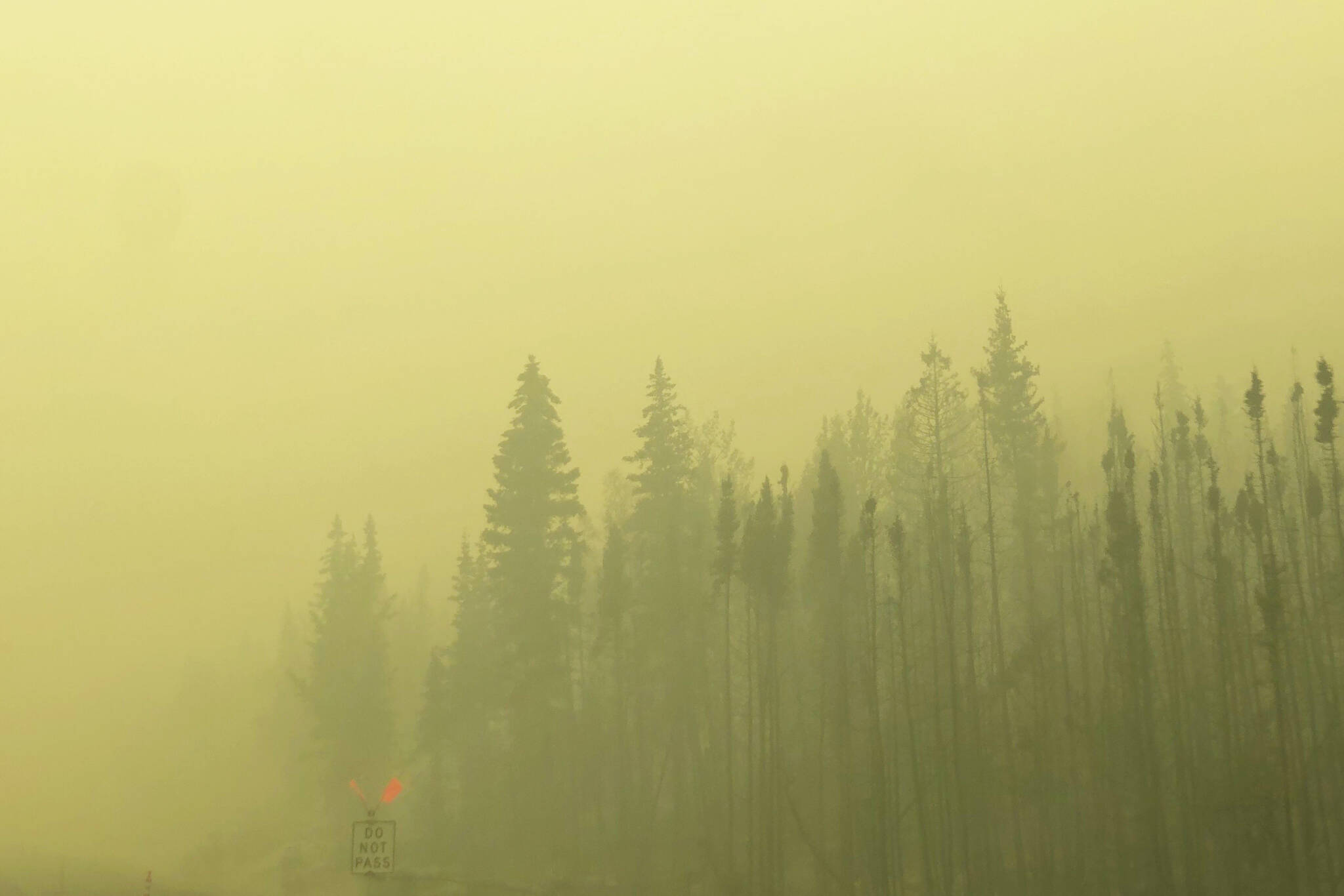 Smoke from the Swan Lake Fire impairs visibility on the Sterling Highway on Aug. 20, 2019. (Photo by Victoria Petersen/Peninsula Clarion)