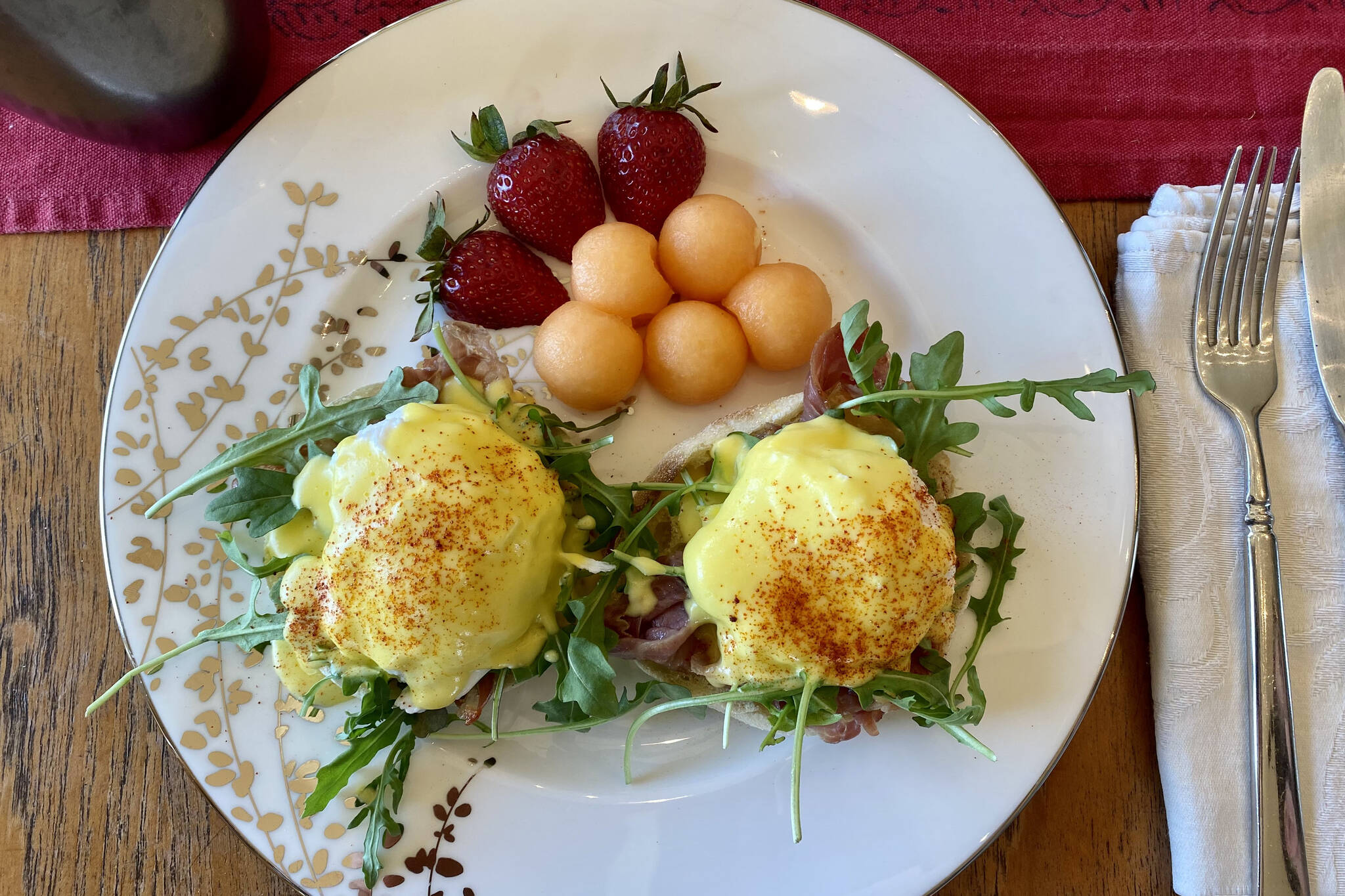 Eggs Benedict are served with hollandaise on a bed of arugula and prosciutto. (Photo by Tressa Dale/Peninsula Clarion)