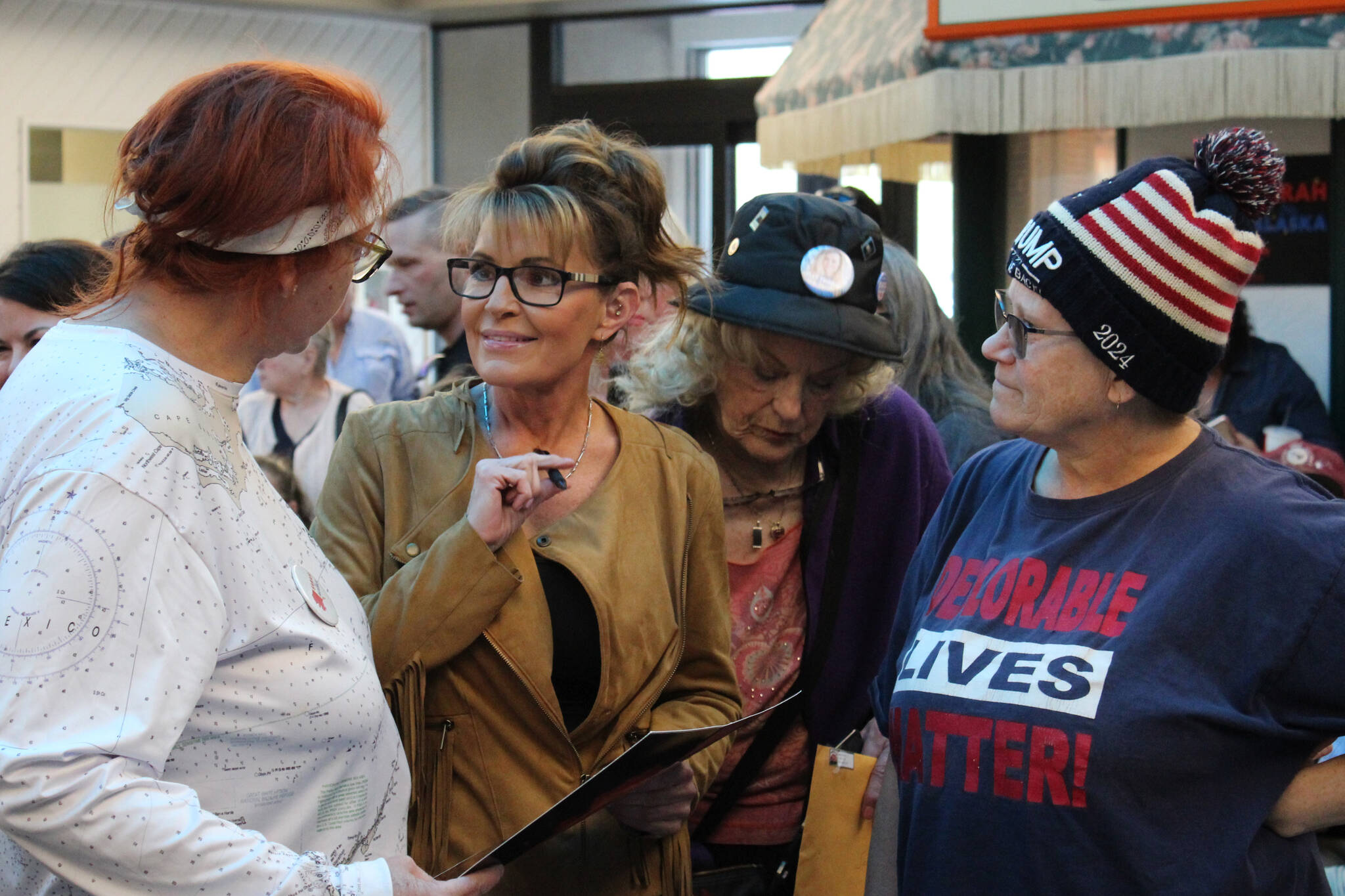 Former Alaska governor and current congressional hopeful Sarah Palin speaks with attendees at a meet-and-greet event outside of Ginger’s Restaurant on Saturday, May 14, 2022, in Soldotna, Alaska. (Ashlyn O’Hara/Peninsula Clarion)