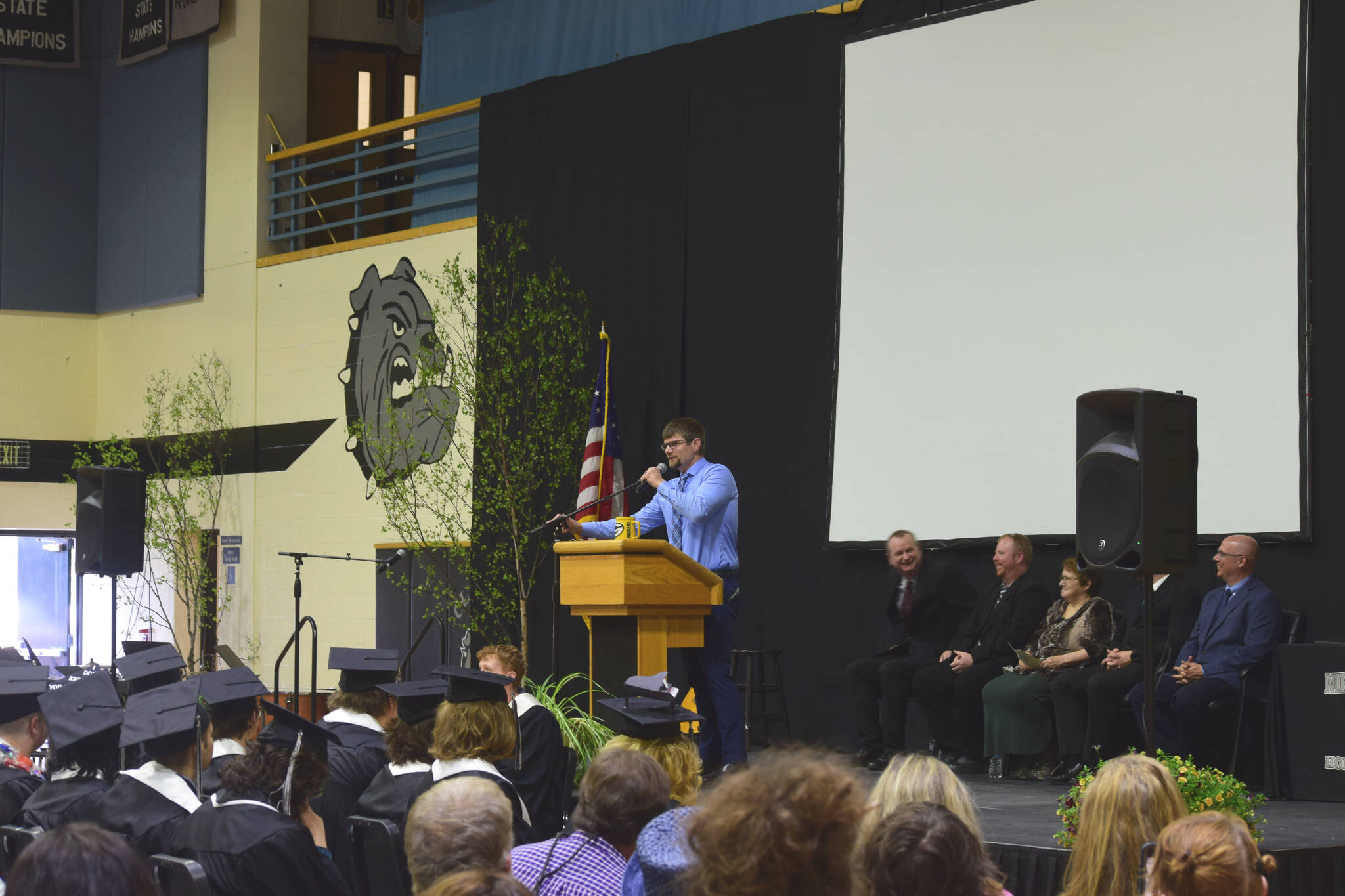 Nikiski Middle/High School teacher Jesse Bjorkman delivers a commencement address at the school’s 2022 commencement ceremony on Monday, May 16, 2022 in Nikiski, Alaska. (Ashlyn O’Hara/Peninsula Clarion)