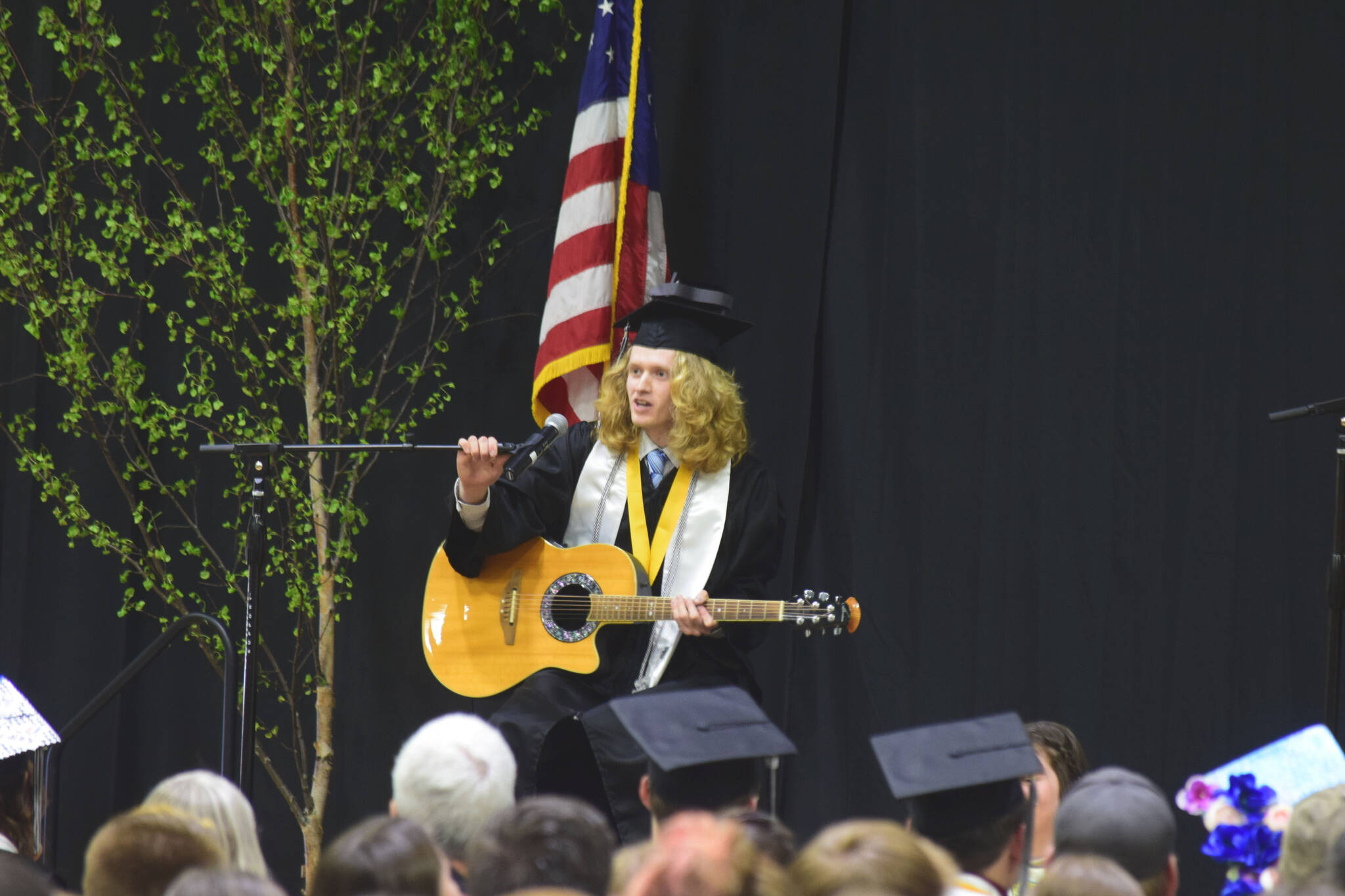 Nikiski Middle/High School Valedictorian Levi Anderson performs John Mayer’s “Stop This Train” during the school’s 2022 commencement ceremony on Monday, May 16, 2022 in Nikiski, Alaska. (Ashlyn O’Hara/Peninsula Clarion)