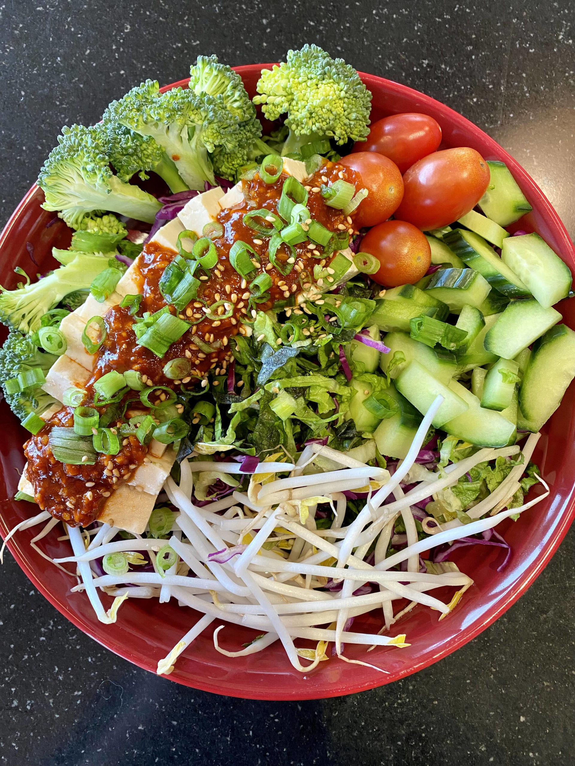 Gochujang dressing spices up tofu, lettuce, veggies and sprouts. (Photo by Tressa Dale/Peninsula Clarion)
