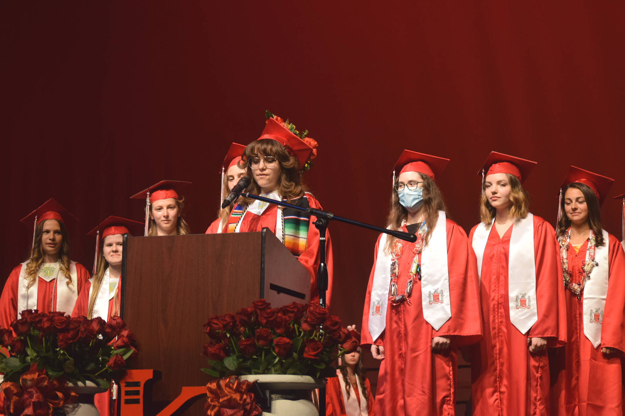 Andrea Cordero (center) speaks as one of Kenai Central High School’s valedictorians during the school’s graduation ceremony on Tuesday, May 17, 2022, in Kenai, Alaska. (Ashlyn O’Hara/Peninsula Clarion)