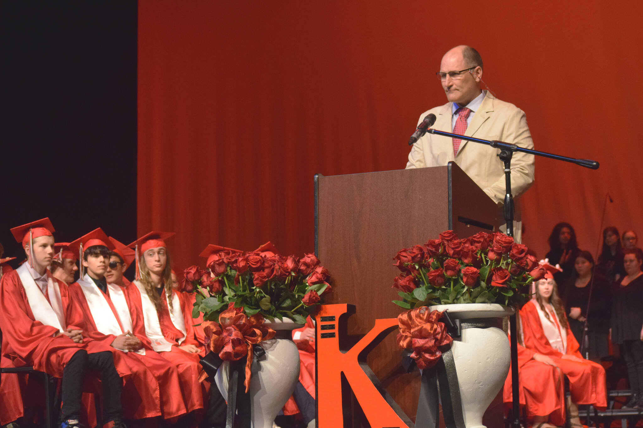 Kenai Central High School Principal Daniel Beck welcomes graduates and attendees to the school’s commencement ceremony on Tuesday, May 17, 2022, in Kenai, Alaska. (Ashlyn O’Hara/Peninsula Clarion)
