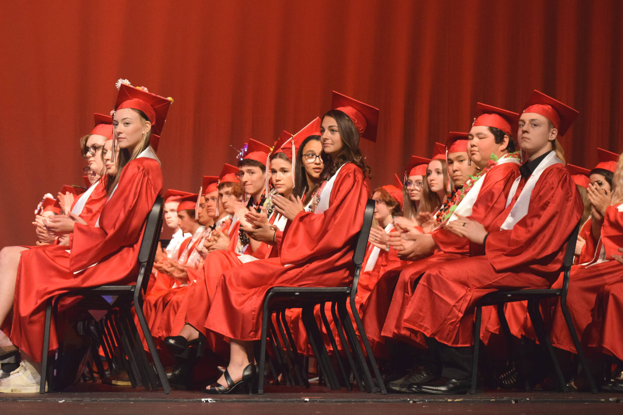 Kenai Central High School graduates applaud during their commencement ceremony on Tuesday, May 17, 2022, in Kenai, Alaska. (Ashlyn O’Hara/Peninsula Clarion)