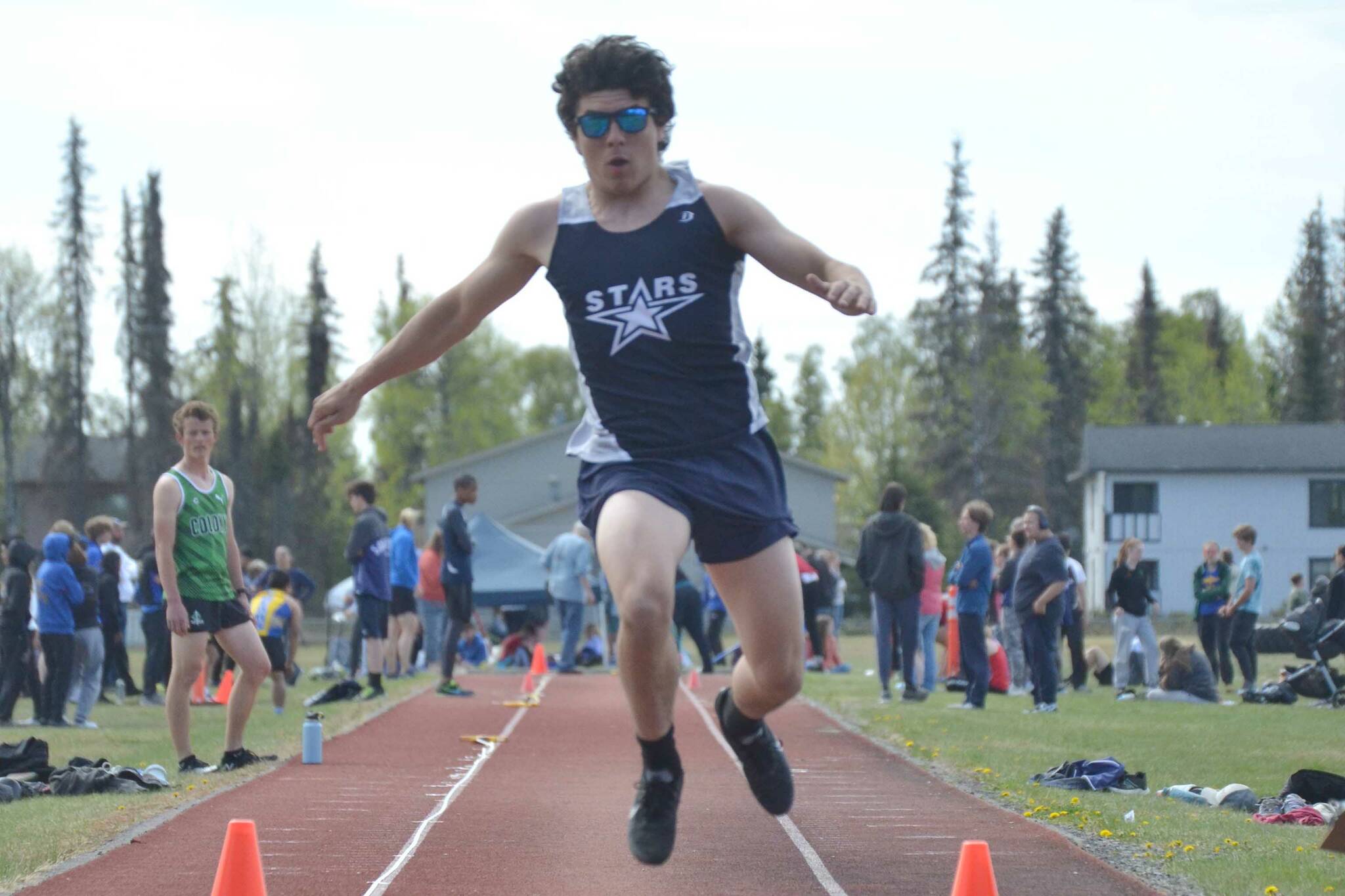 Soldotna's Isaac Chavarria competes in the triple jump at the Region 3/Division I meet at Ed Hollier Field at Kenai Central High School in Kenai, Alaska, on Saturday, May 21, 2022. (Photo by Jeff Helminiak/Peninsula Clarion)