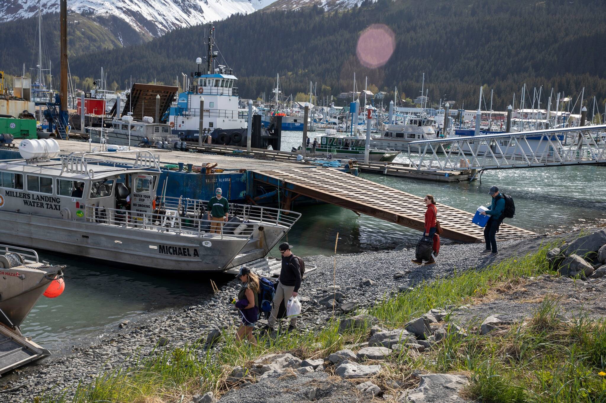 People load into water taxis at the Seward Harbor on Sunday, May 22, 2022 in Seward, Alaska. (Photo courtesy Kenai Peninsula Borough Office of Emergency Management)