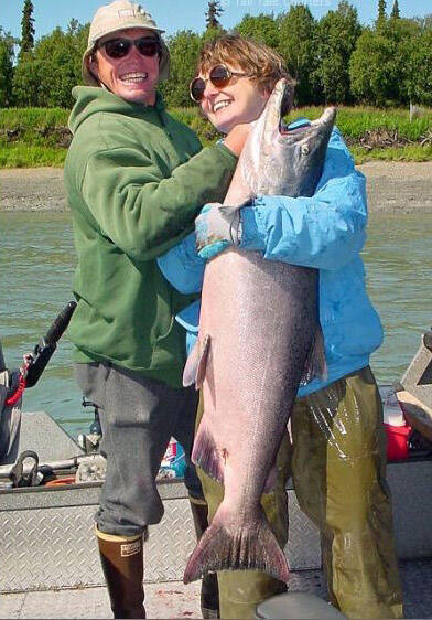 A Kenai River fisherman and his mother celebrate a successful catch. (Photo by Boo Kandas)
