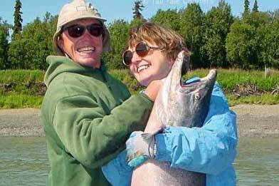 A Kenai River fisherman and his mother celebrate a successful catch. (Photo by Boo Kandas)