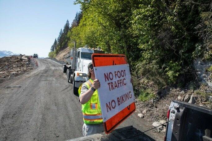 Signs are placed on Lowell Point Road ahead of the road opening in Seward, Alaska, May 27, 2022, following the May 7 Bear Mountain landslide. (Photo and caption courtesy Kenai Peninsula Borough)