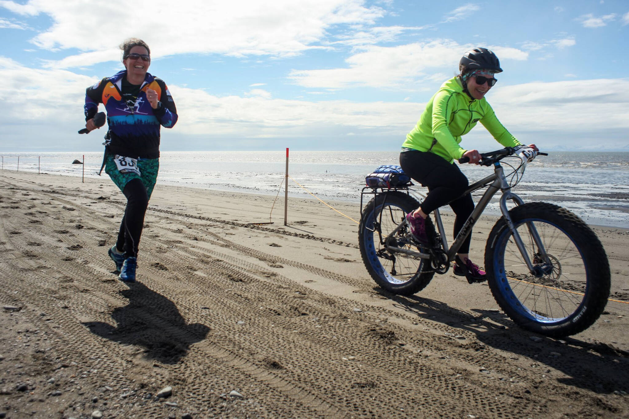 Heather Renner and Tasha Reynolds run and fat bike to the finish line on the Kenai Beach during the 2019 Mouth to Mouth Wild Run & Ride. (Photo courtesy Kaitlin Vadla)