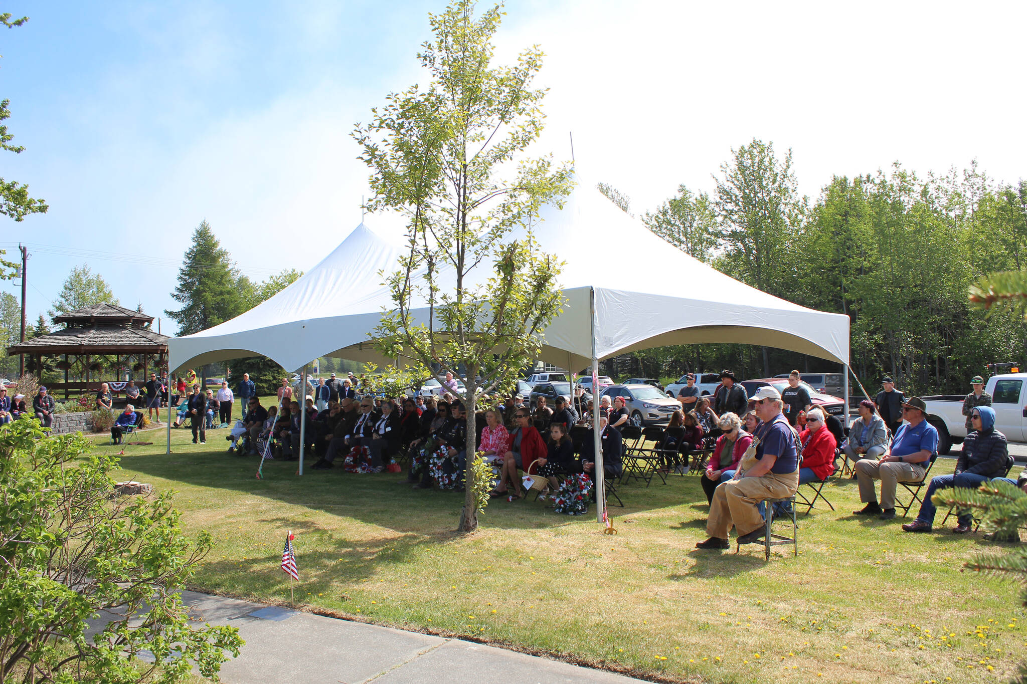 Community members gather at Leif Hansen Memorial Park in Kenai, Alaska, on Monday, May 30, 2022, to commemorate Memorial Day. (Camille Botello/Peninsula Clarion)