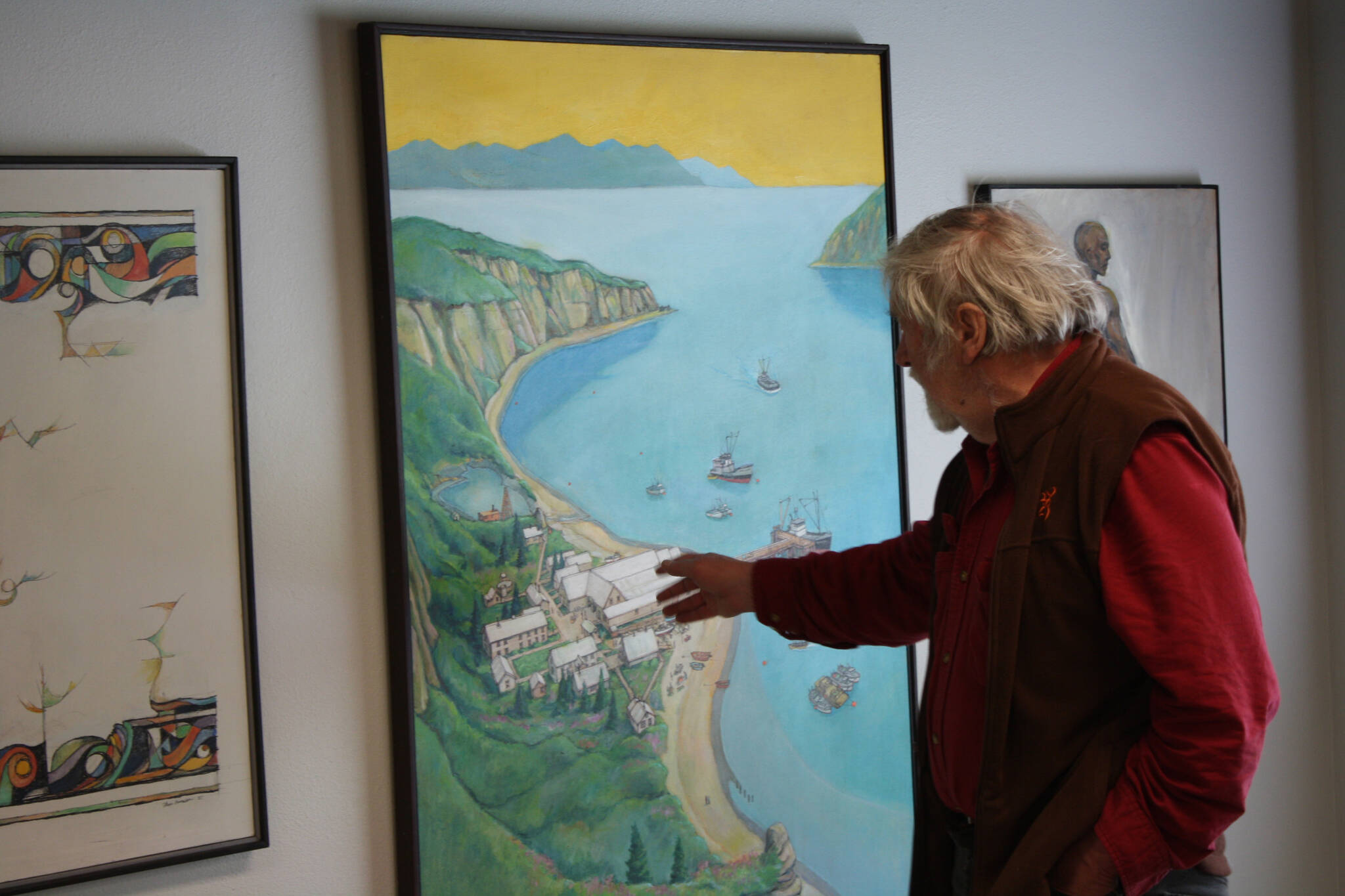 Thor Evenson gets an early look at his exibition at the Kenai Art Center on Tuesday, May 31, 2022. (Camille Botello/Peninsula Clarion)