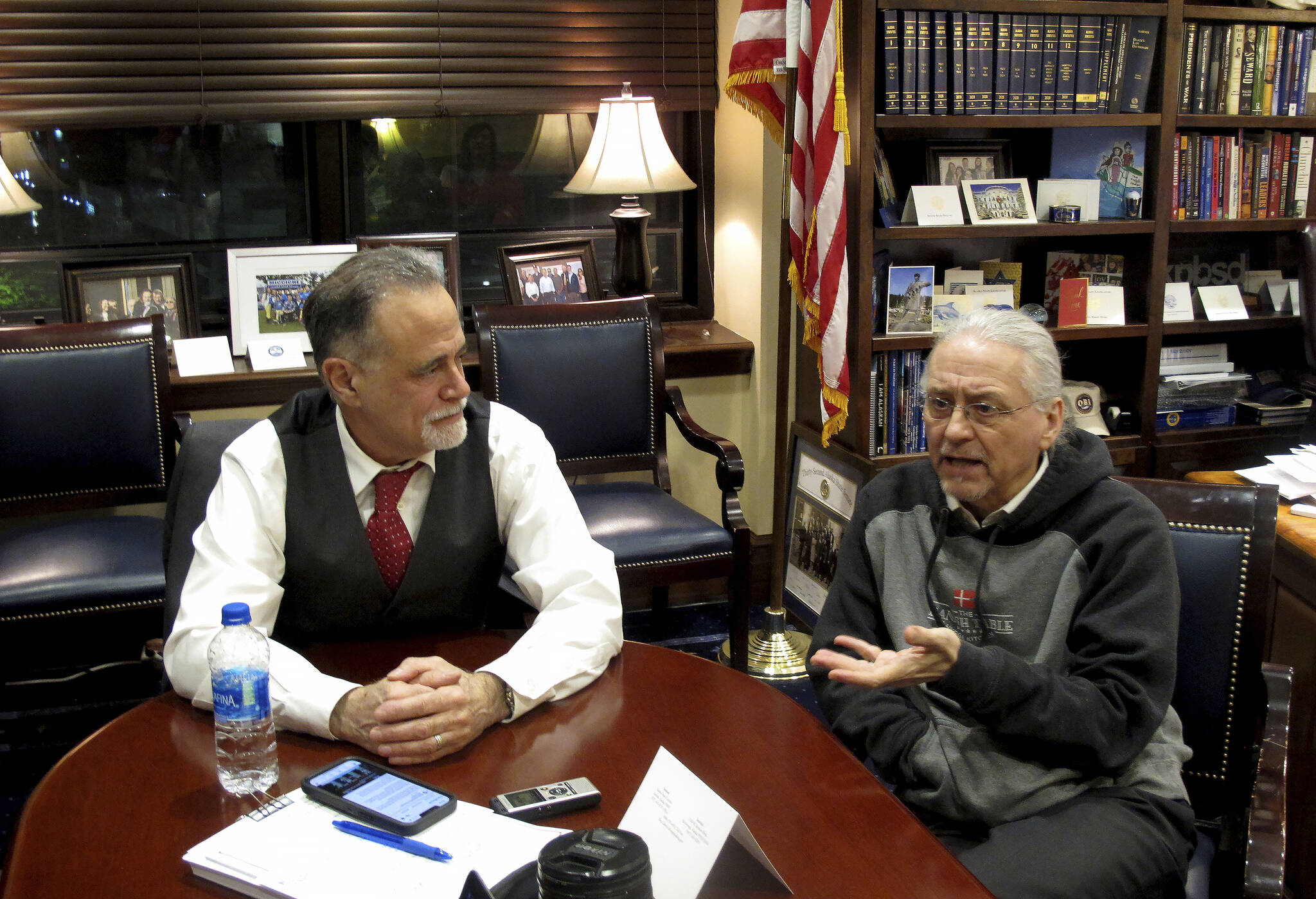Alaska Senate President Peter Micciche, left, and Senate Minority Leader Tom Begich, right, meet with reporters in Micciche’s office in the early morning hours of Thursday, May 19, 2022, in Juneau, Alaska, after the Legislature ended its regular session. Micciche, a Republican, said last month that he is not seeking reelection this year and Begich, a Democrat, announced Thursday, June, 2, 2022 that he is likely to withdraw his candidacy next week. (AP Photo/Becky Bohrer, File)