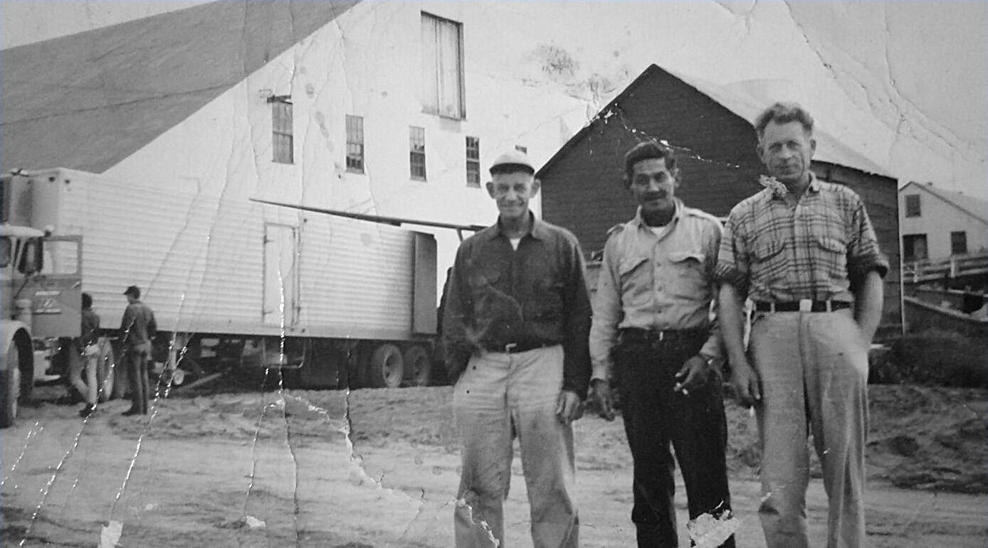 Kenai cannery owner Harold Daubenspeck, right, stands with Peter Kalifornsky, center, and an unidentified man. The photo, circa 1950s-1960s, was provided by the Facebook page “A Work in Progress: Growing up on the Kenai.”