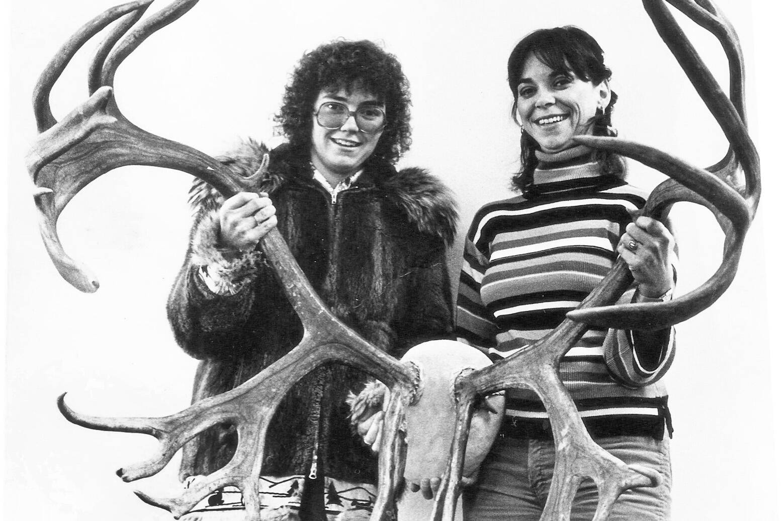 Marcia and Mary Alice Grainge pose in 1980 with a pair of caribou antlers they found in 1972. The sisters dug the antlers from deep snow and detached them from a dead caribou. (Photo provided by Marcia Grainge King)