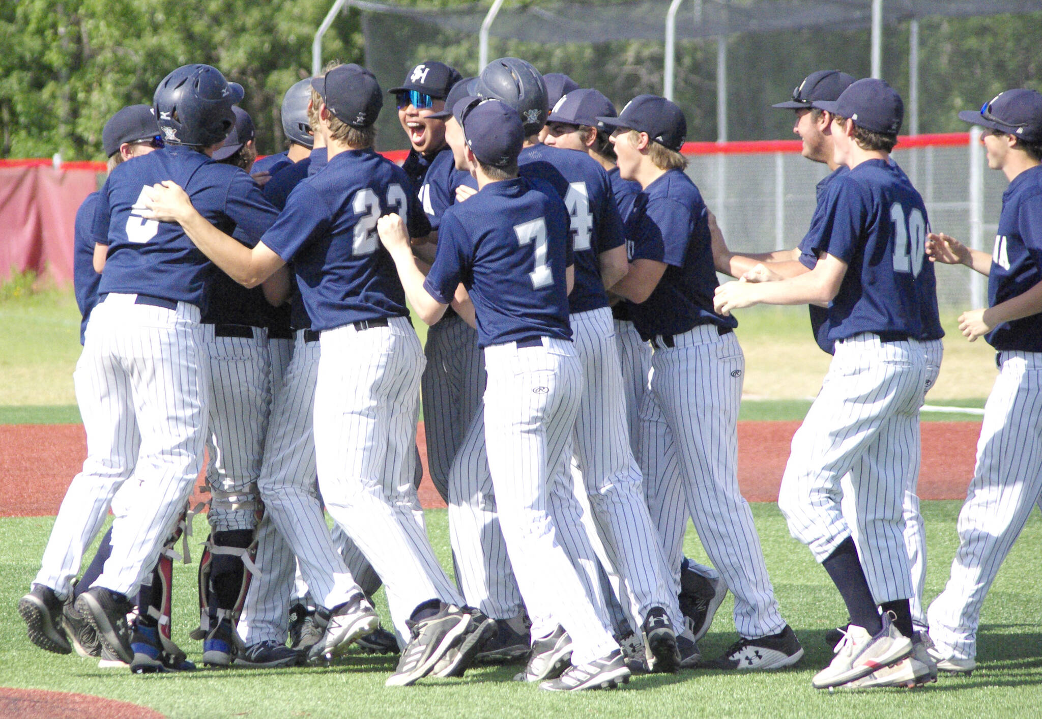 The Soldotna baseball team celebrates winning the Division II state tournament Saturday, June 4, 2022, at Wasilla High School in Wasilla, Alaska. (Photo by Jeff Helminiak/Peninsula Clarion)