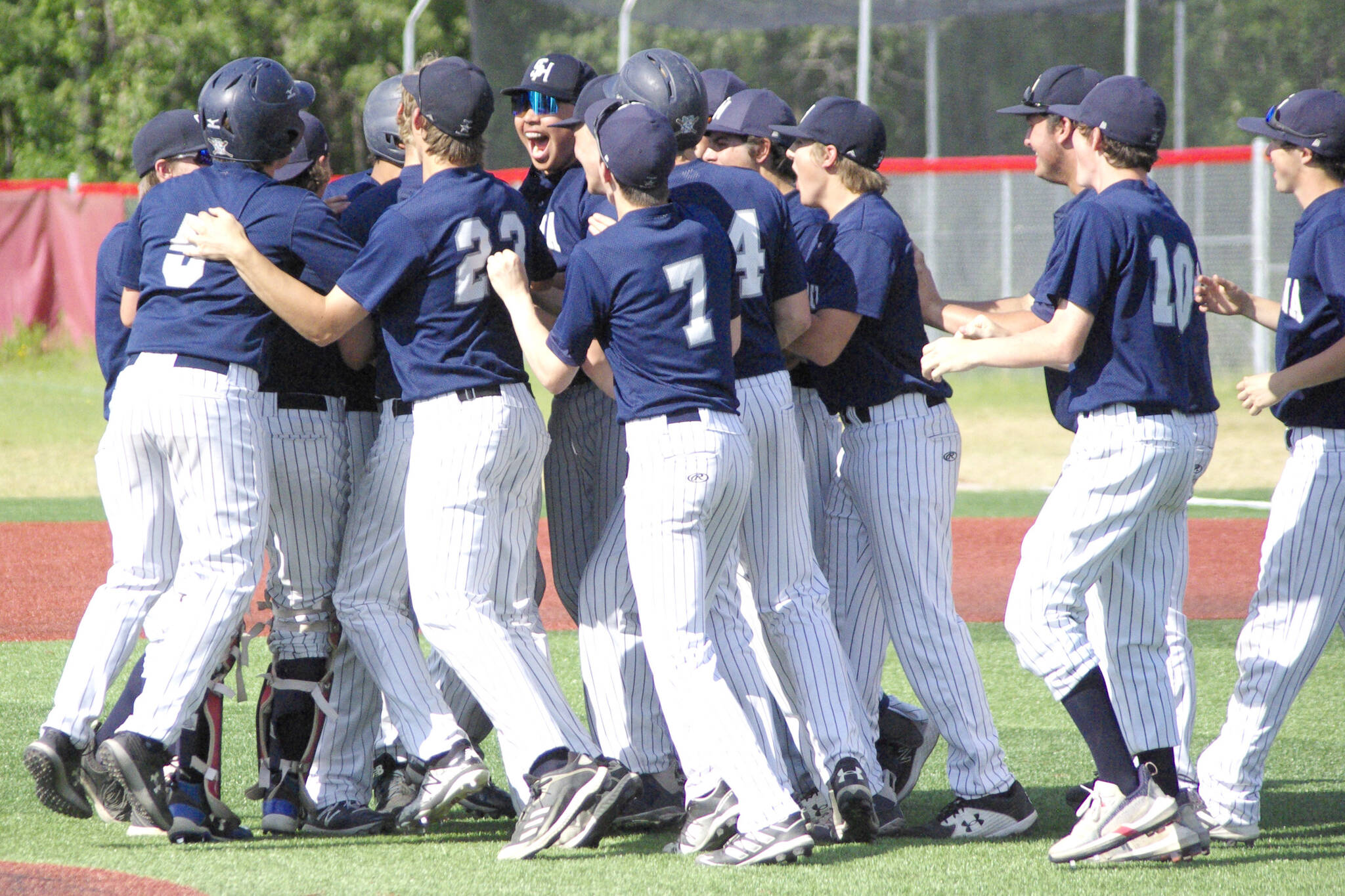 The Soldotna baseball team celebrates winning the Division II state tournament Saturday, June 4, 2022, at Wasilla High School in Wasilla, Alaska. (Photo by Jeff Helminiak/Peninsula Clarion)