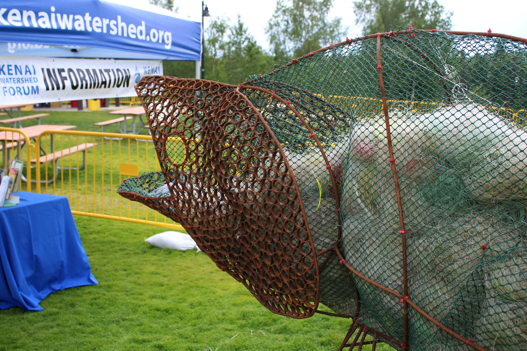 A salmon sculpture is displayed outside of the Kenai Watershed Forum tent at the 2022 Kenai River Festival on Friday, June 10, 2022 in Soldotna, Alaska. (Ashlyn O’Hara/Peninsula Clarion)