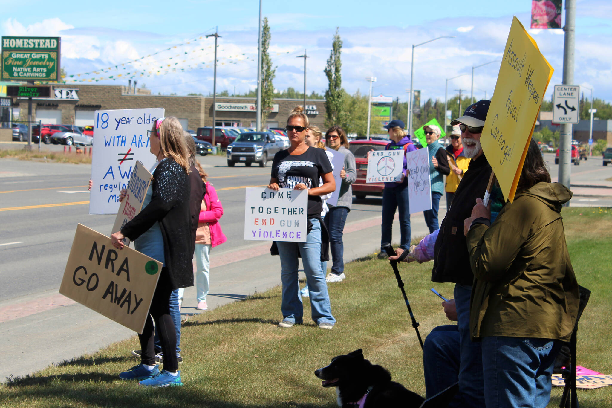 People hold signs during a demonstration opposing gun violence on Saturday, June 11, 2022, in Soldotna, Alaska. The local protest was part of a nationwide call to action issued by the nonprofit organization March for Our Lives, which was formed after a 2018 school shooting in Parkland, Florida, and aims to end gun violence. (Ashlyn O’Hara/Peninsula Clarion)
People hold signs during a demonstration opposing gun violence on Saturday, June 11, 2022 in Soldotna, Alaska. The local protest was part of a nationwide call to action issued by the nonprofit organization March for Our Lives, which was formed after a 2018 school shooting in Parkland, Florida and aims to end gun violence. (Ashlyn O’Hara/Peninsula Clarion)