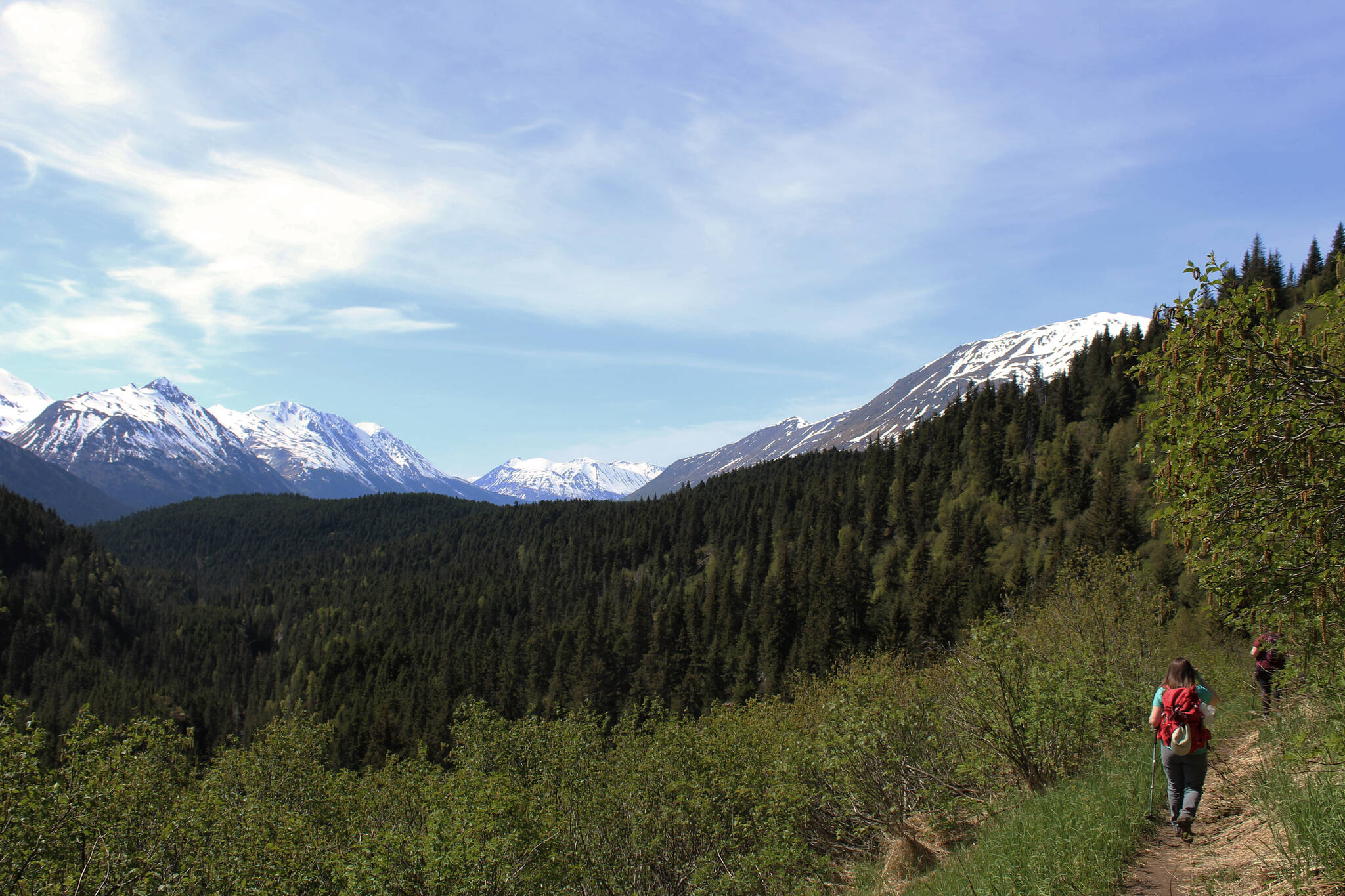 Hikers walk along the Ptarmigan Lake trail on Sunday, May 22, 2022 near Seward, Alaska. (Ashlyn O’Hara/Peninsula Clarion)