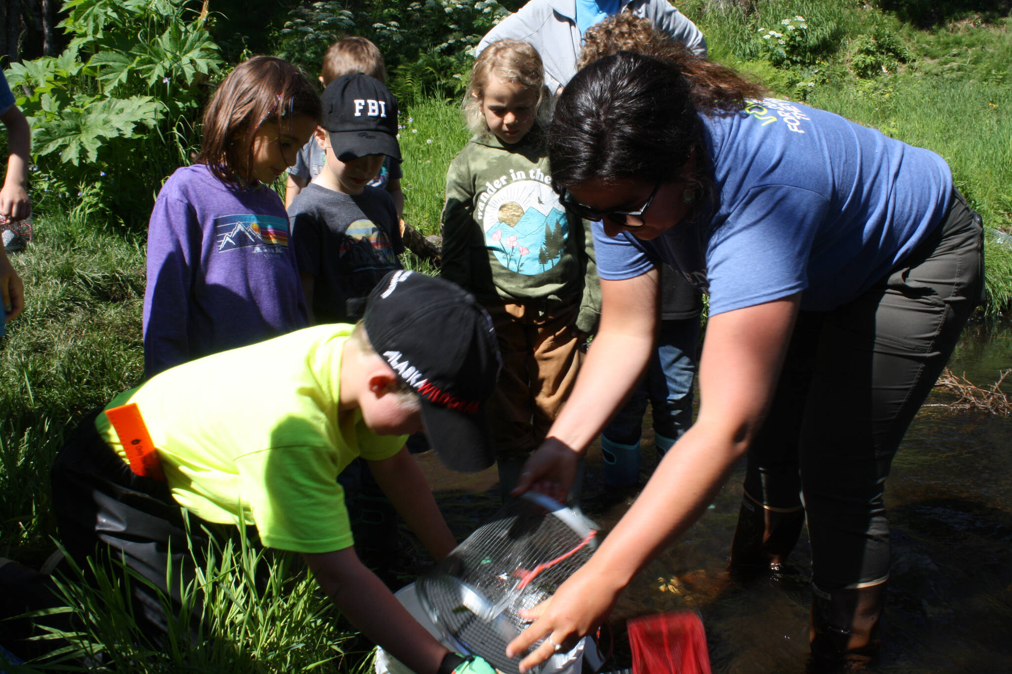 Education Specialist Megan Pike leads the fish observation activity during the Novice Naturalist Camp at the Kenai Watershed Forum in Soldotna, Alaska, on Tuesday, June 21, 2022. (Camille Botello/Peninsula Clarion)