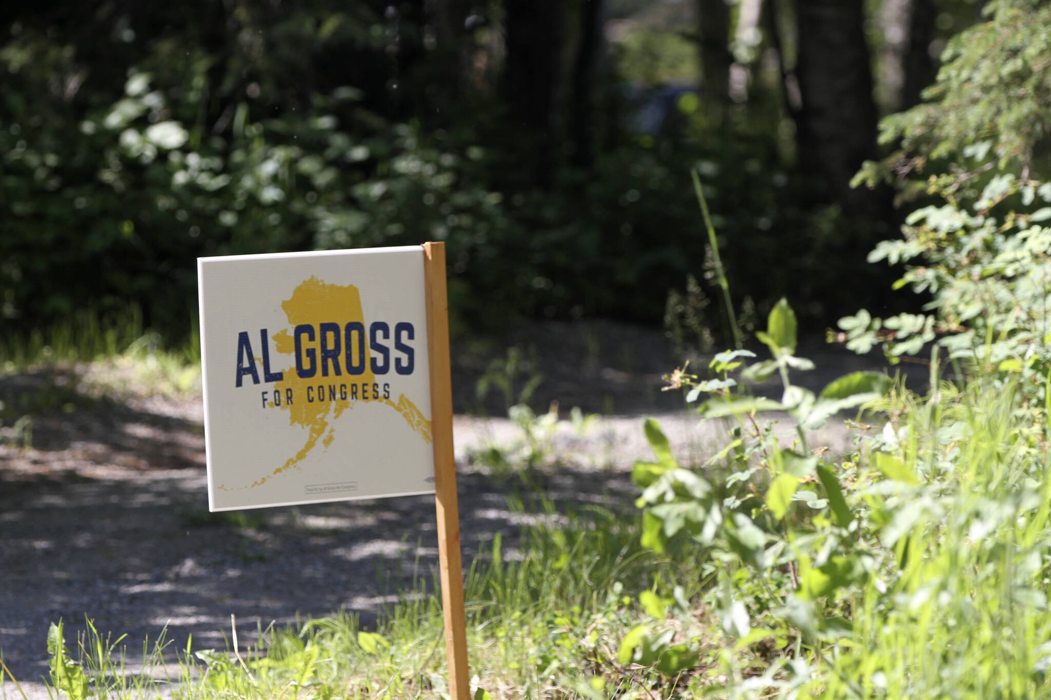 An “Al Gross for Congress” sign sits near the driveway to Gross’ home in Anchorage, Alaska, on Tuesday, June 21, 2022, after he announced plans to withdraw from the U.S. House race. Gross has given little explanation in two statements for why he is ending his campaign, and a woman who answered the door at the Gross home asked a reporter to leave the property. (AP Photo/Mark Thiessen)