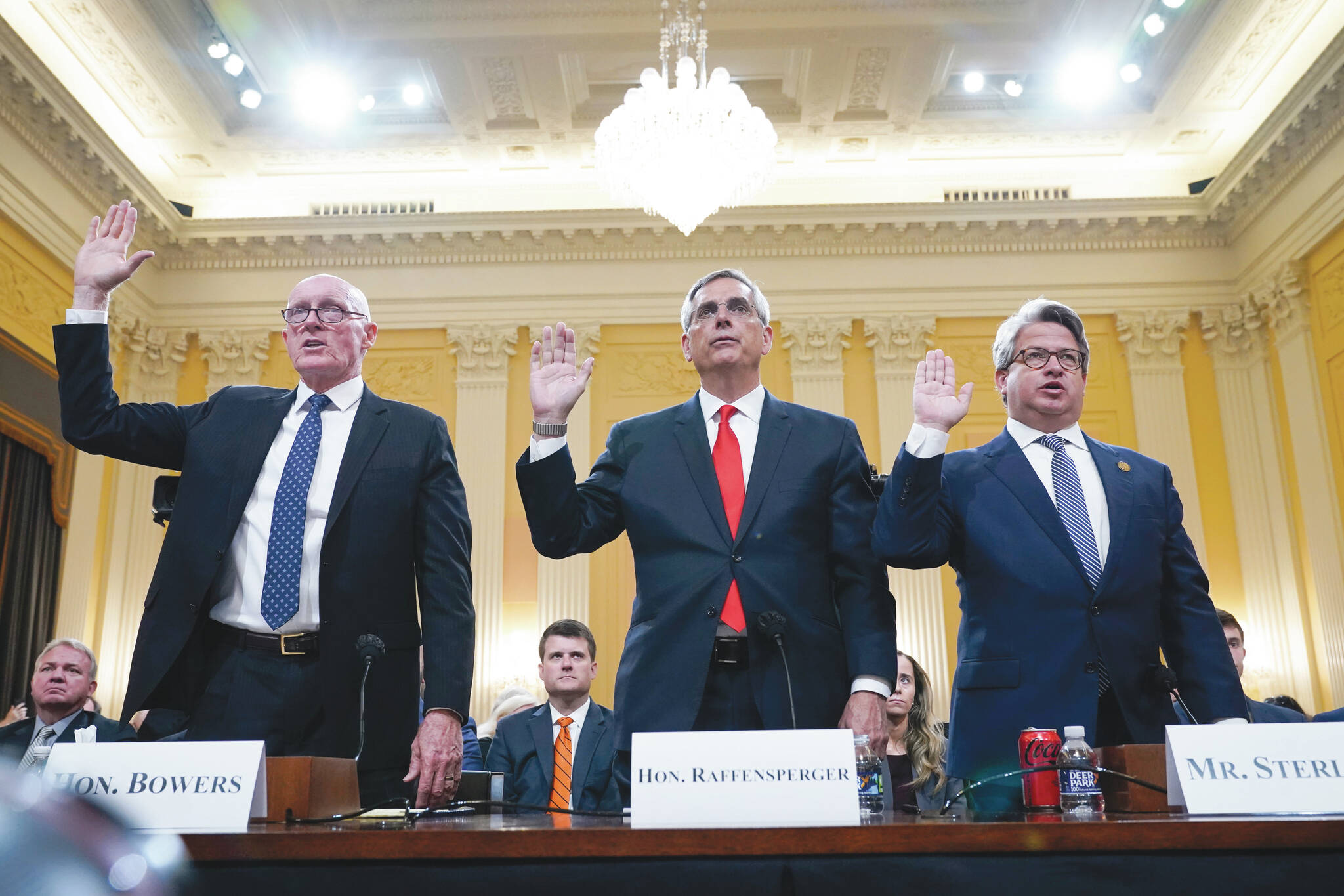 AP Photo/Jacquelyn Martin
Rusty Bowers, Arizona state House Speaker, from left, Brad Raffensperger, Georgia Secretary of State, and Gabe Sterling, Georgia Deputy Secretary of State, are sworn in to testify as the House select committee investigating the Jan. 6 attack on the U.S. Capitol continues to reveal its findings of a yearlong investigation, at the Capitol in Washington, Tuesday.