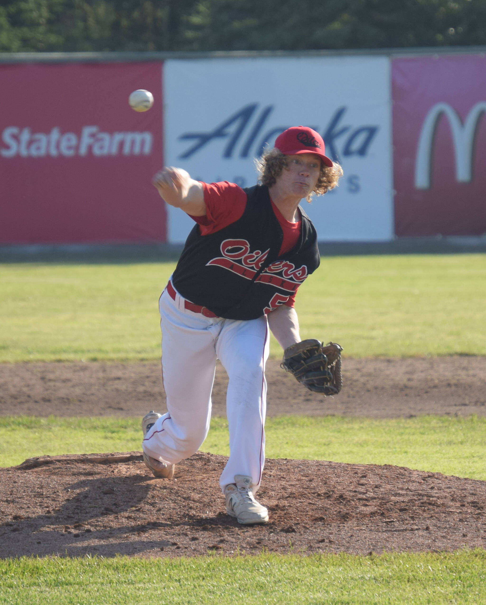 Oilers relief pitcher Mose Hayes delivers to the Anchorage Glacier Pilots on Wednesday, June 22, 2022, at Coral Seymour Memorial Park in Kenai, Alaska. (Photo by Jeff Helminiak/Peninsula Clarion)