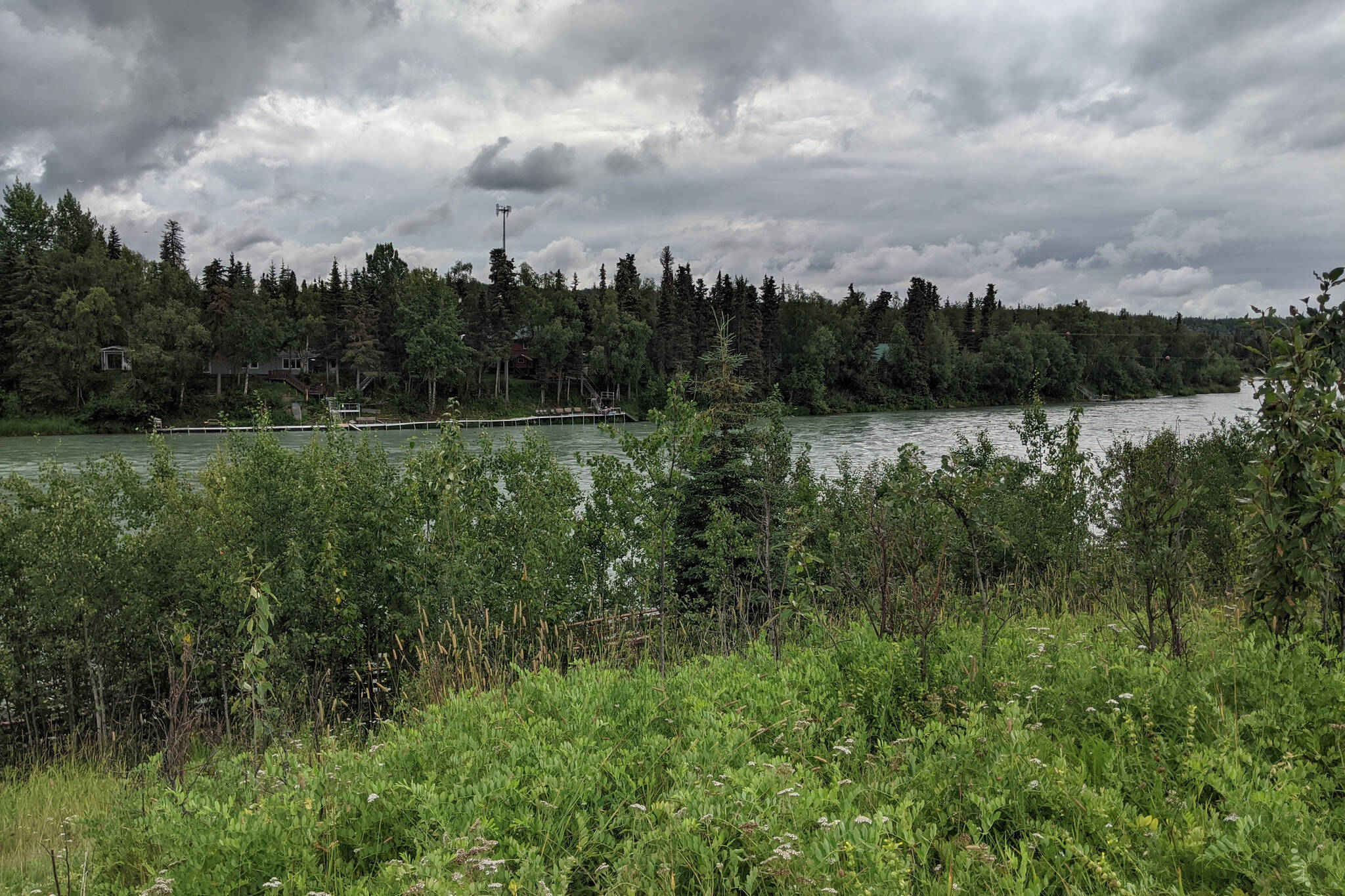 The Kenai River runs alongside a strip of land near the Sterling Highway on May 17, 2020, in Soldotna, Alaska. The City of Soldotna was awarded $360,000 from a federal grant program offered through the U.S. Economic Development Agency to start planning what’s been called a “main street” adjacent to the Kenai River. (Photo by Erin Thompson/Peninsula Clarion)