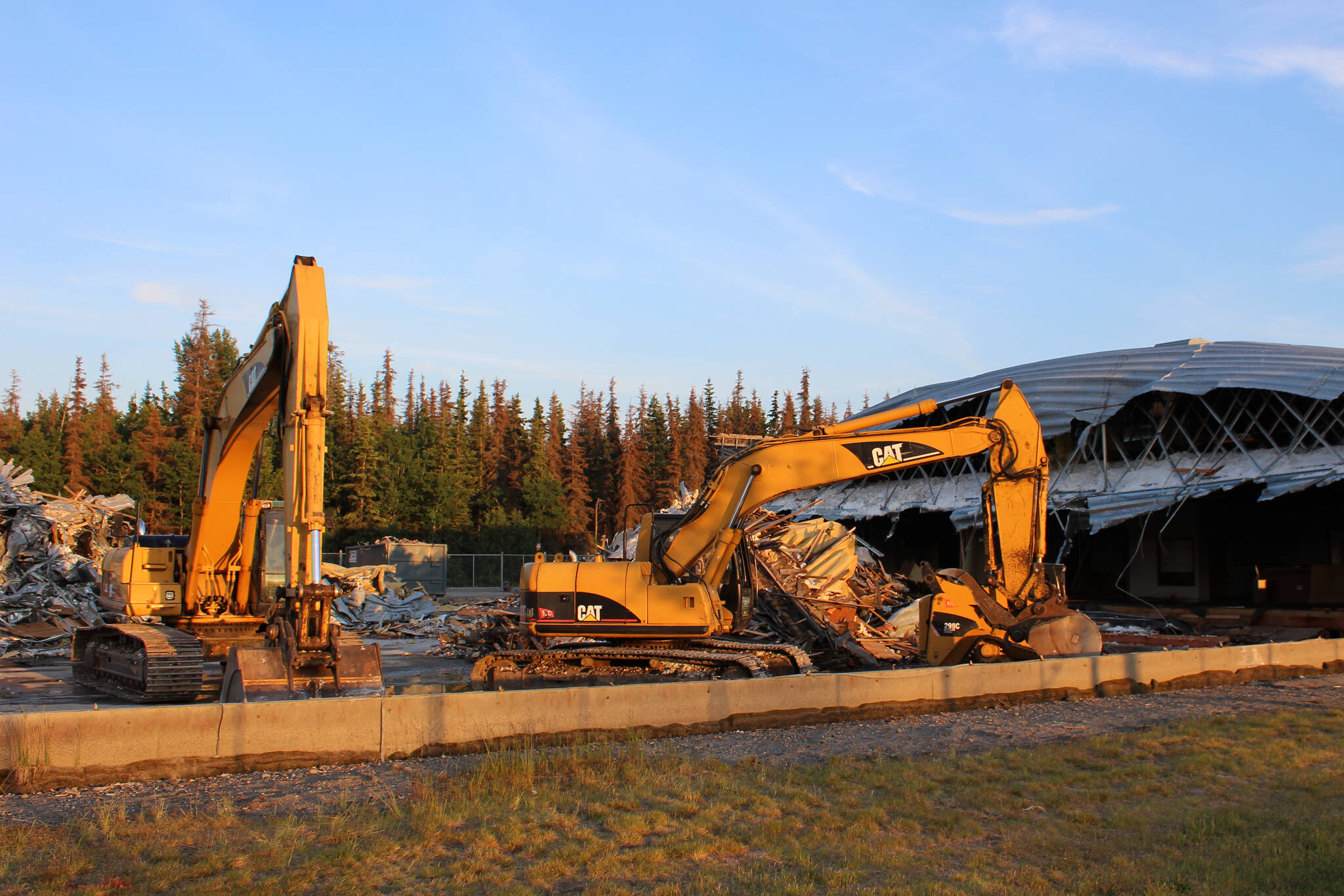 Buldozers sit outside of the former Kenai Bowling Alley on Thursday, June 23, 2022, in Kenai, Alaska. (Ashlyn O’Hara/Peninsula Clarion)