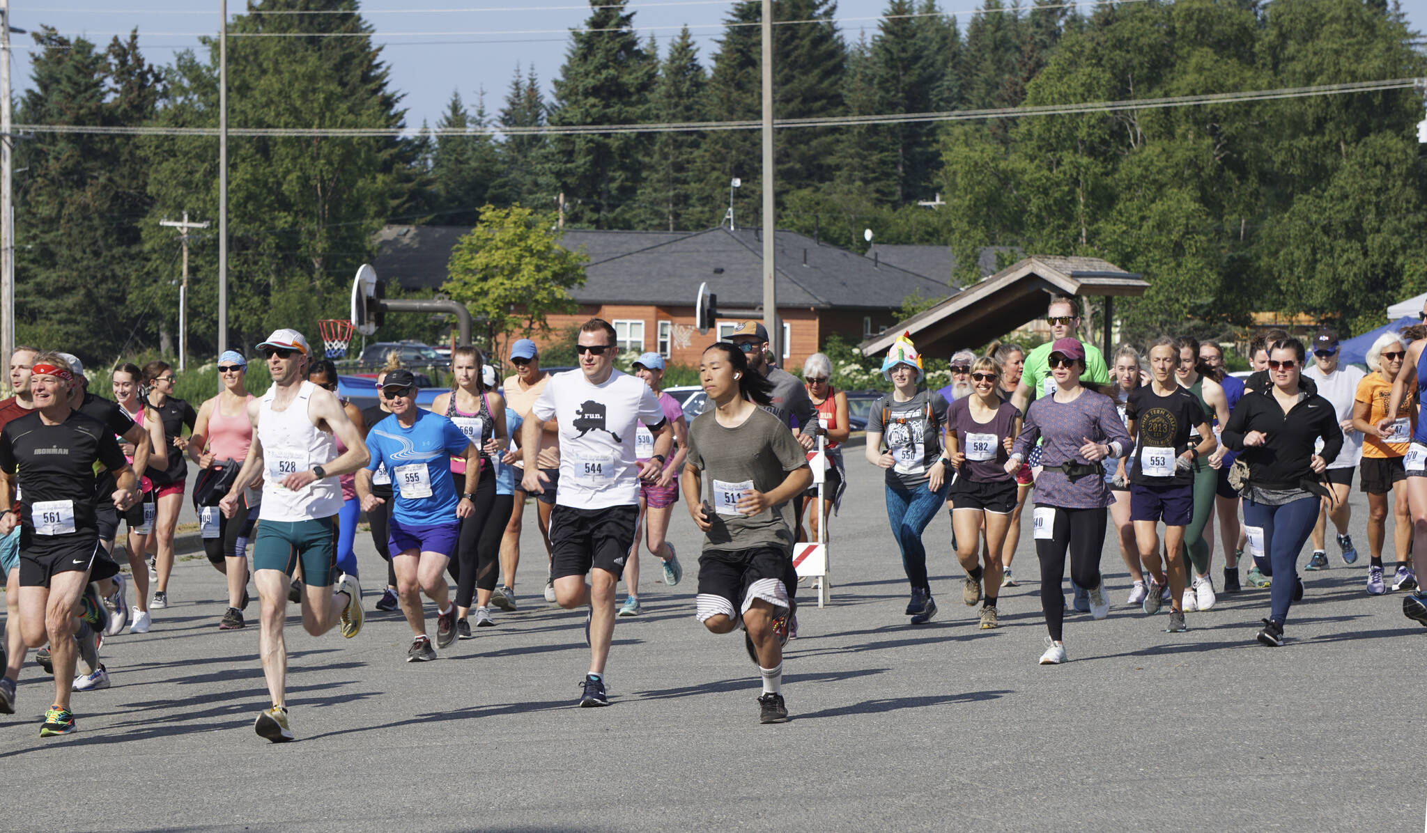 The Homer Spit Run 10k runners take off at the start of the run on Saturday, July 25, 2022, at Homer High School in Homer, Alaska. (Photo by Michael Armstrong/Homer News)