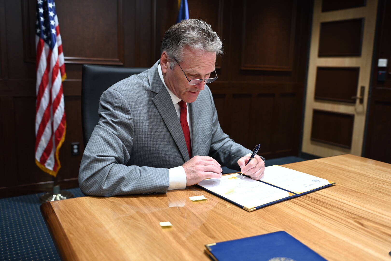 Gov. Mike Dunleavy signs Alaska’s fiscal year 2023 operating and capital budgets into law on Tuesday, June 28, 2022, in Anchorage, Alaska. (Photo courtesy Gov. Mike Dunleavy’s office)