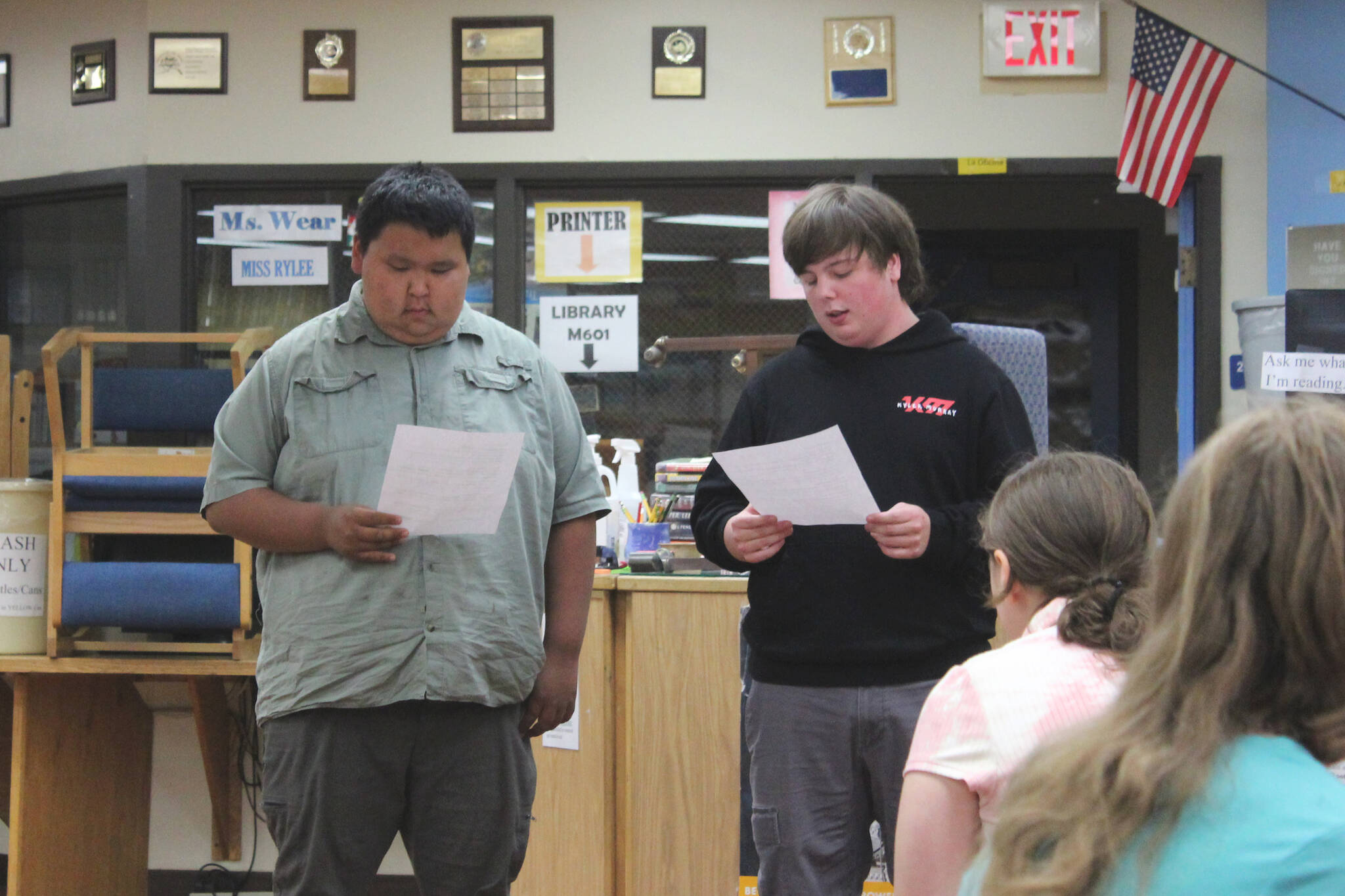 Jacob Wohlers, left, and Bryce LeFevre talk about their experience participating in KPBSD’s Summer Work Program during a program celebration in the Soldotna High School library on Tuesday, June 28, 2022, in Soldotna, Alaska. (Ashlyn O’Hara/Peninsula Clarion)
