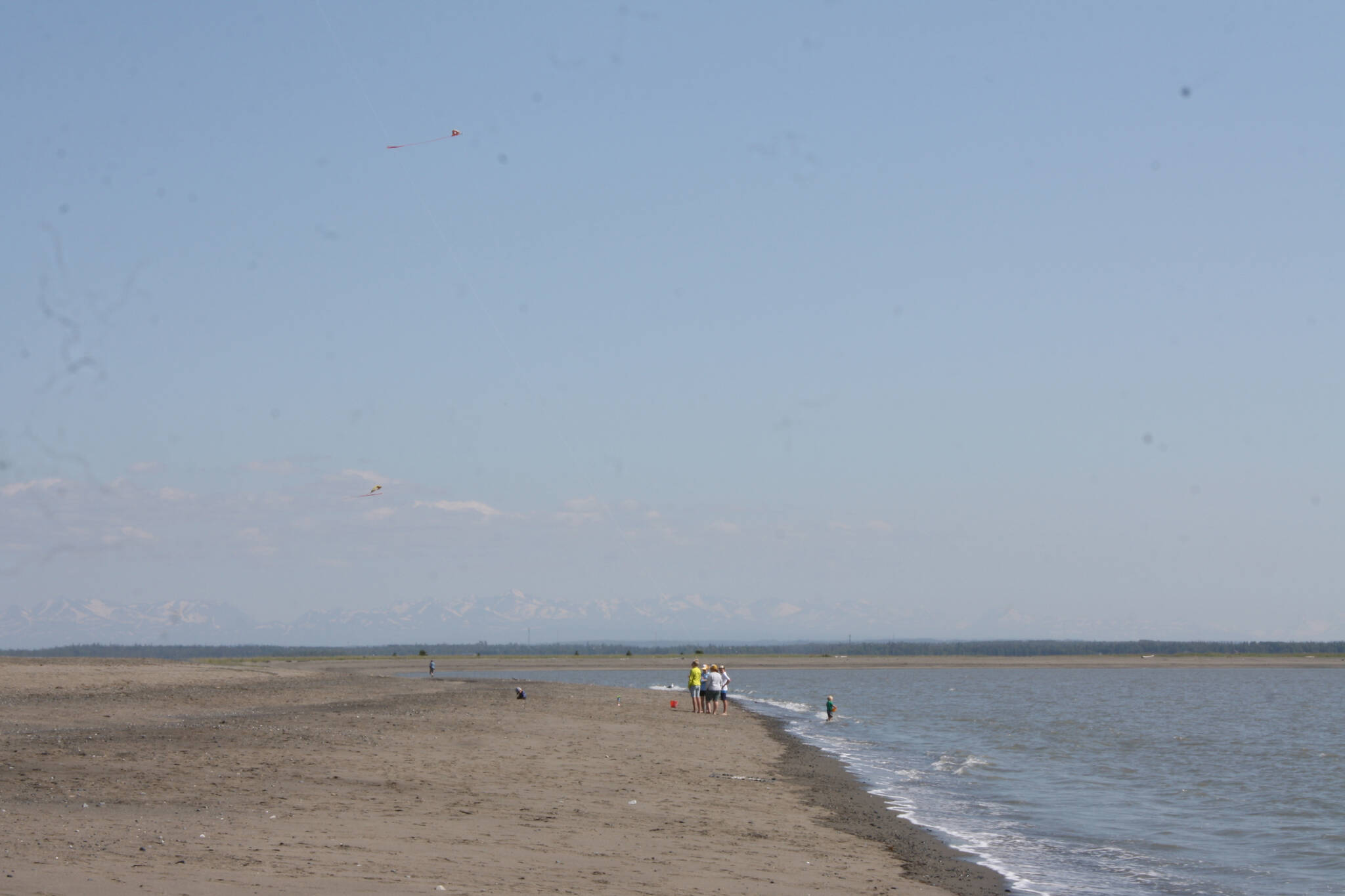 Haze can be seen on the horizon from North Kenai Beach on Tuesday, June 28, 2022, in Kenai, Alaska. An air quality advisory was issued for Southcentral Alaska on Tuesday, triggered by ongoing wildfires in the southwest that have produced increased levels of smoke in the region. (Camille Botello/Peninsula Clarion)