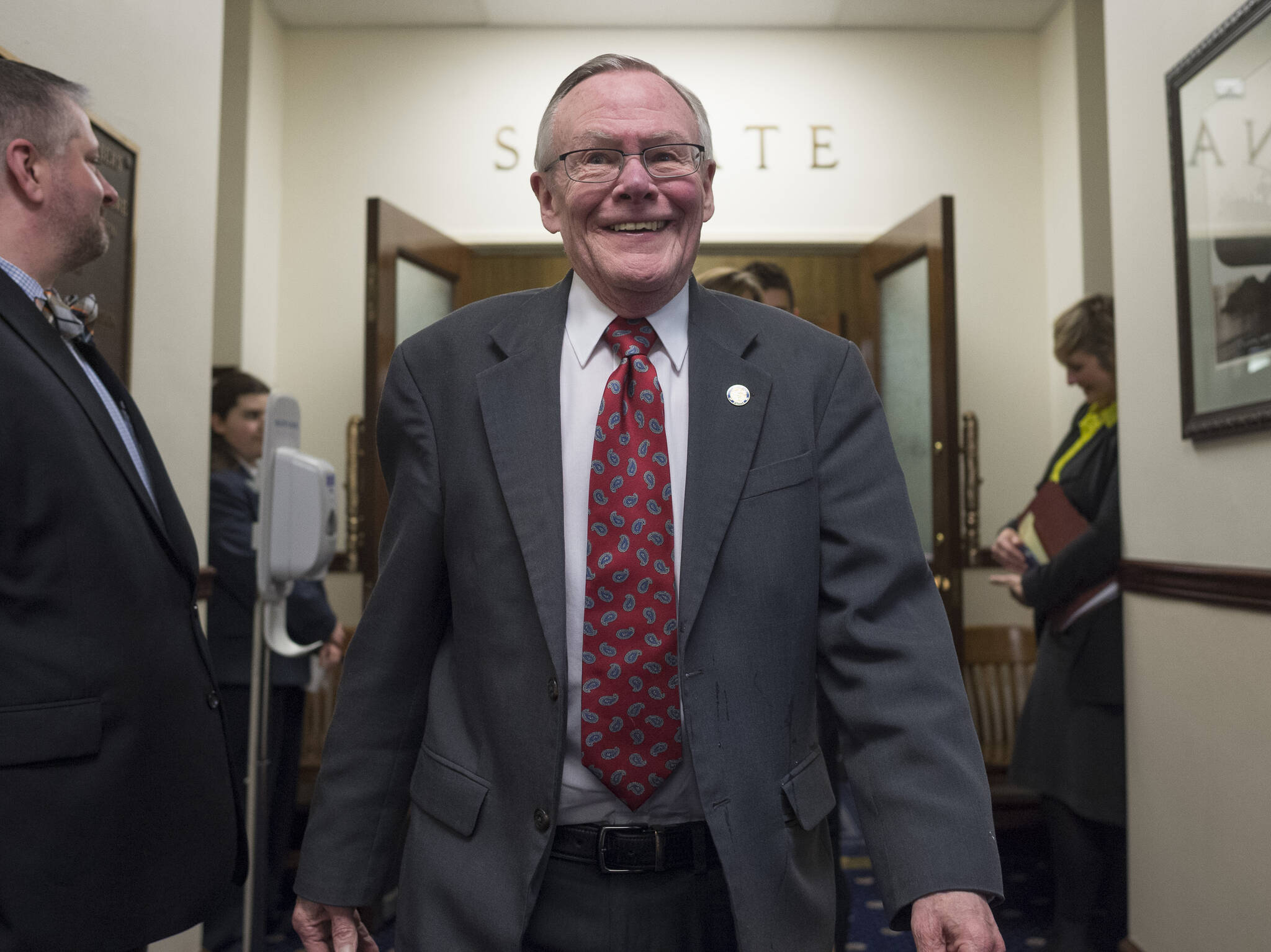 Michael Penn / Juneau Empire File
In this April 11, 2018 photo state Sen. Dennis Egan, D-Juneau, walks out of the Senate chambers and to a reception to honor him and Sen. Berta Gardner, D-Anchorage, at the Capitol. Both were retiring from the legislature.