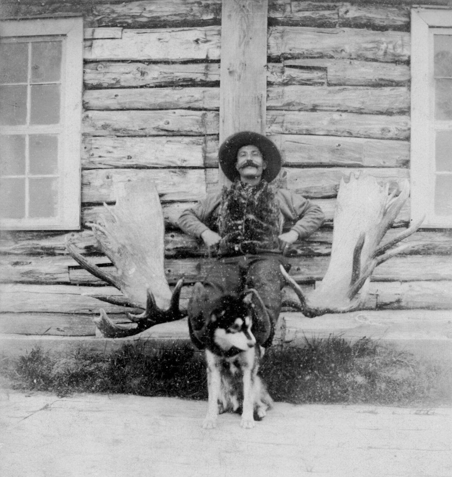 Photo courtesy of the Viani Family Collection 
Frenchy enjoyed photographs that demonstrated his hunting and trading prowess. Here, he poses with a large set of moose antlers and a husky.