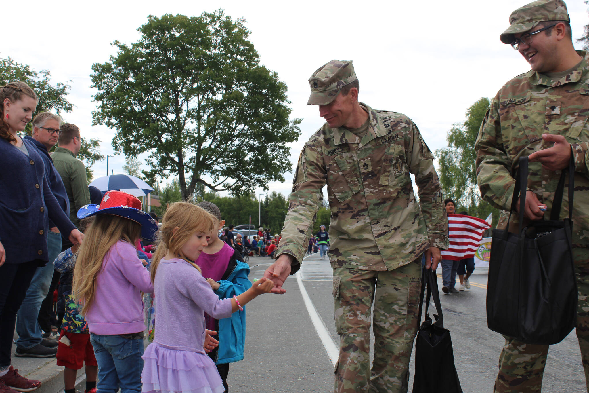 People line the streets in downtown Kenai, Alaska on Monday, July 4, 2022 for the annual Independence Day parade. (Camille Botello/Peninsula Clarion)